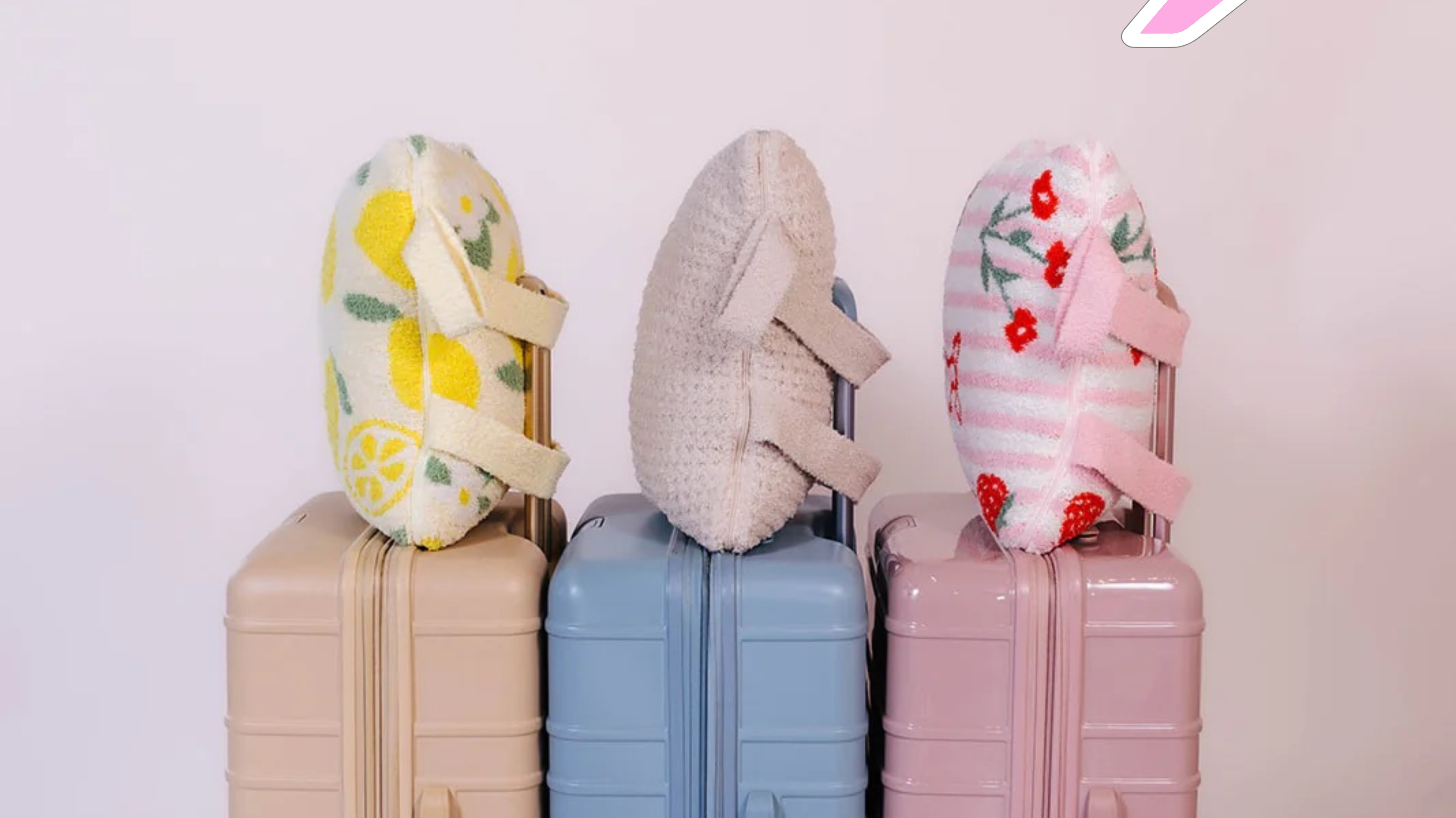 3 quillows on 2 different suitcases