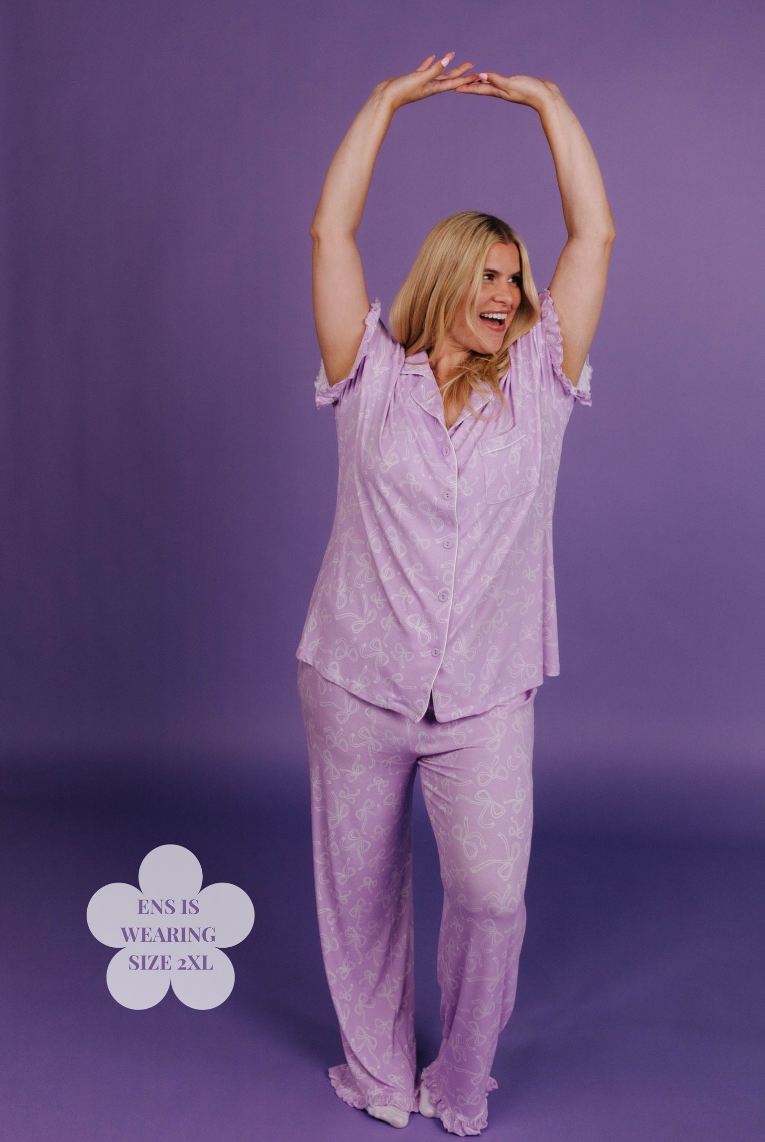 Woman wearing lavender pajamas against a purple background