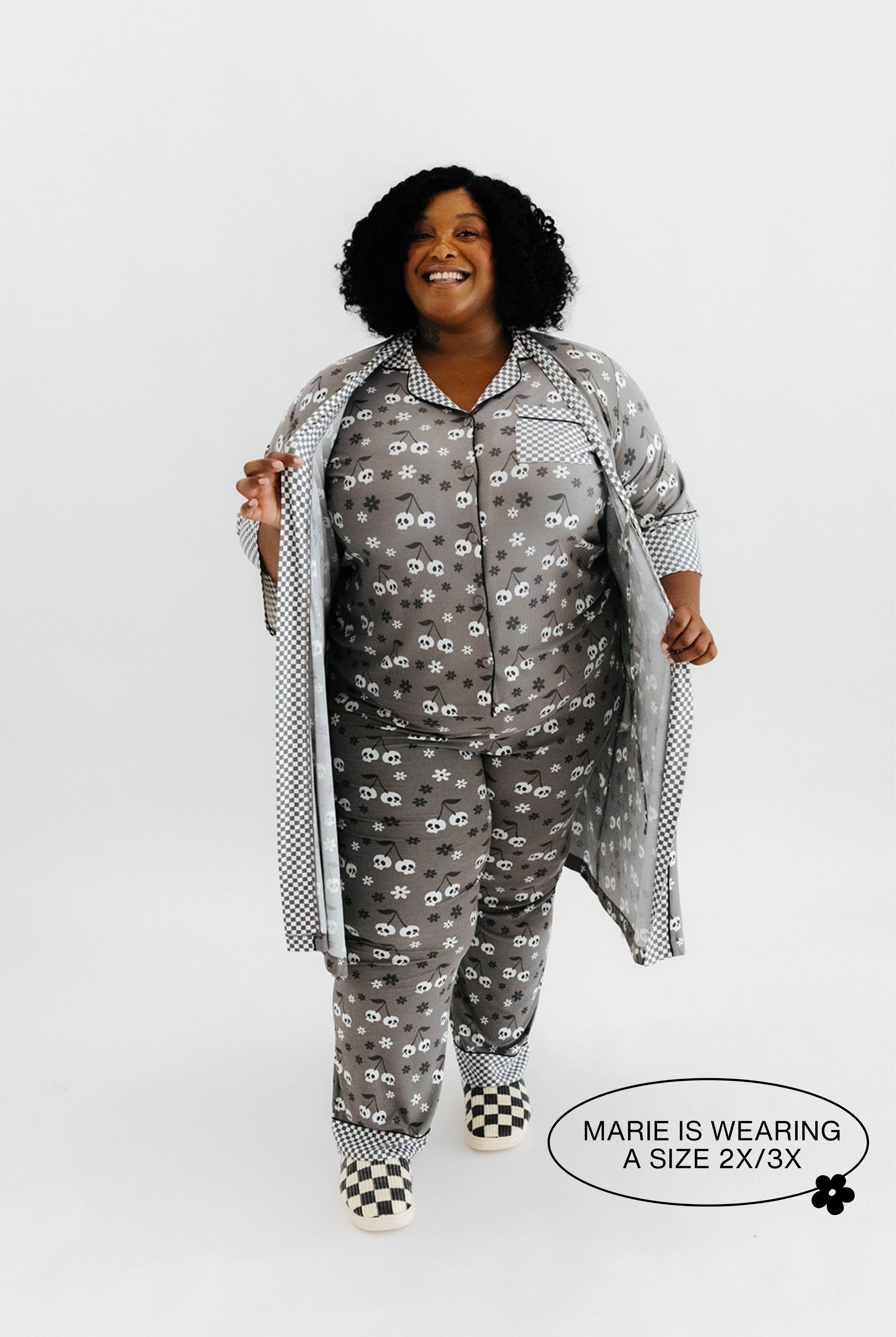 model mari wearing the size 3x in the skelly pajamas and skelly ribbed robe