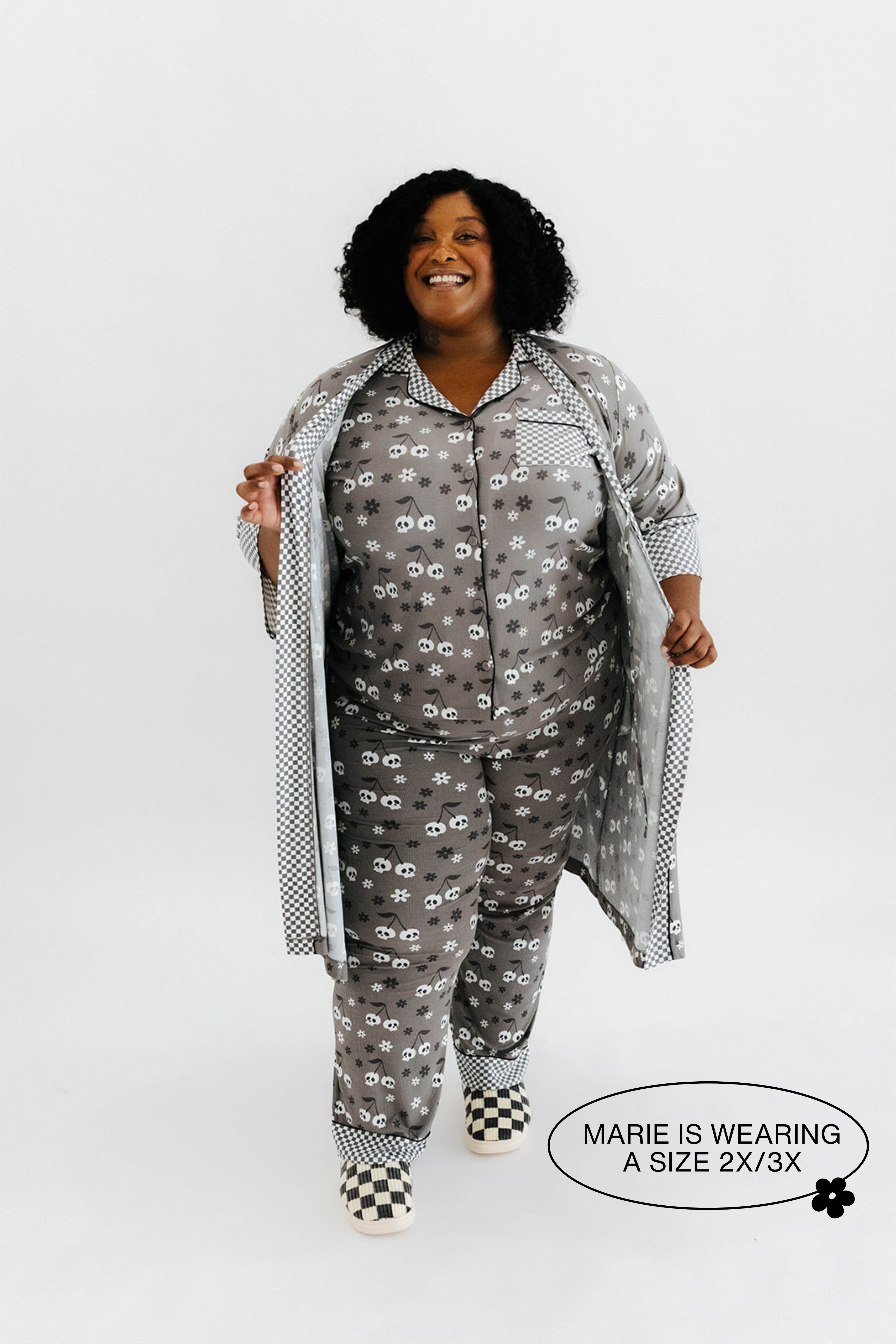 model mari wearing the size 3x in the skelly pajamas and skelly ribbed robe