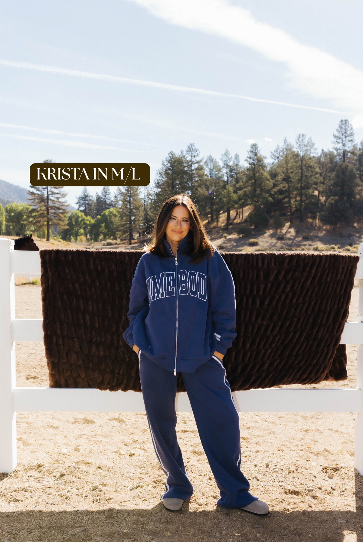 Sizing photo: Krista in M/L wearing blue Homebody sweatshirt and sweatpants.