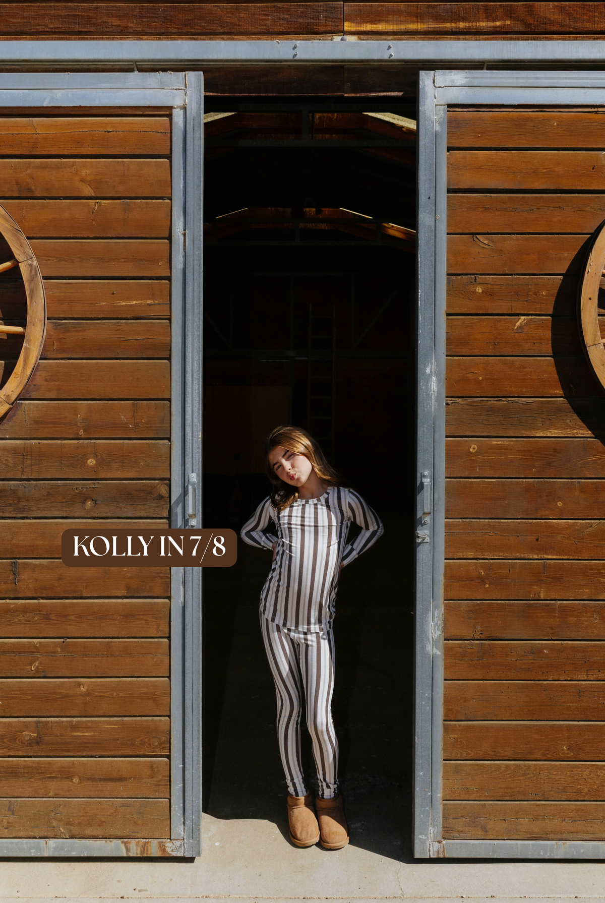 Sizing photo: Kolly in 7/8 wearing brown and cream striped kids pajama set.