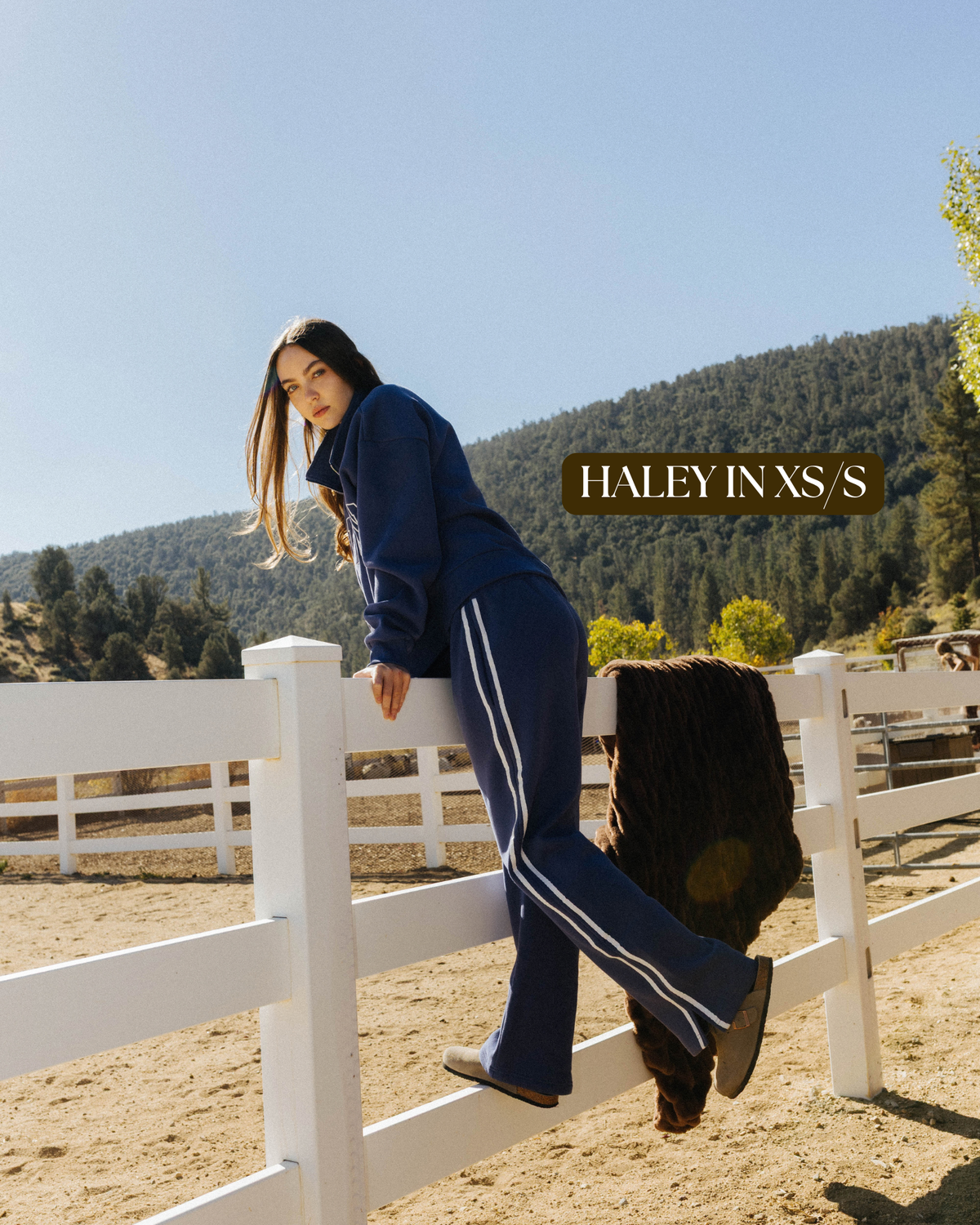 Sizing photo: Haley in XS/S wearing blue Homebody sweatshirt and sweatpants.