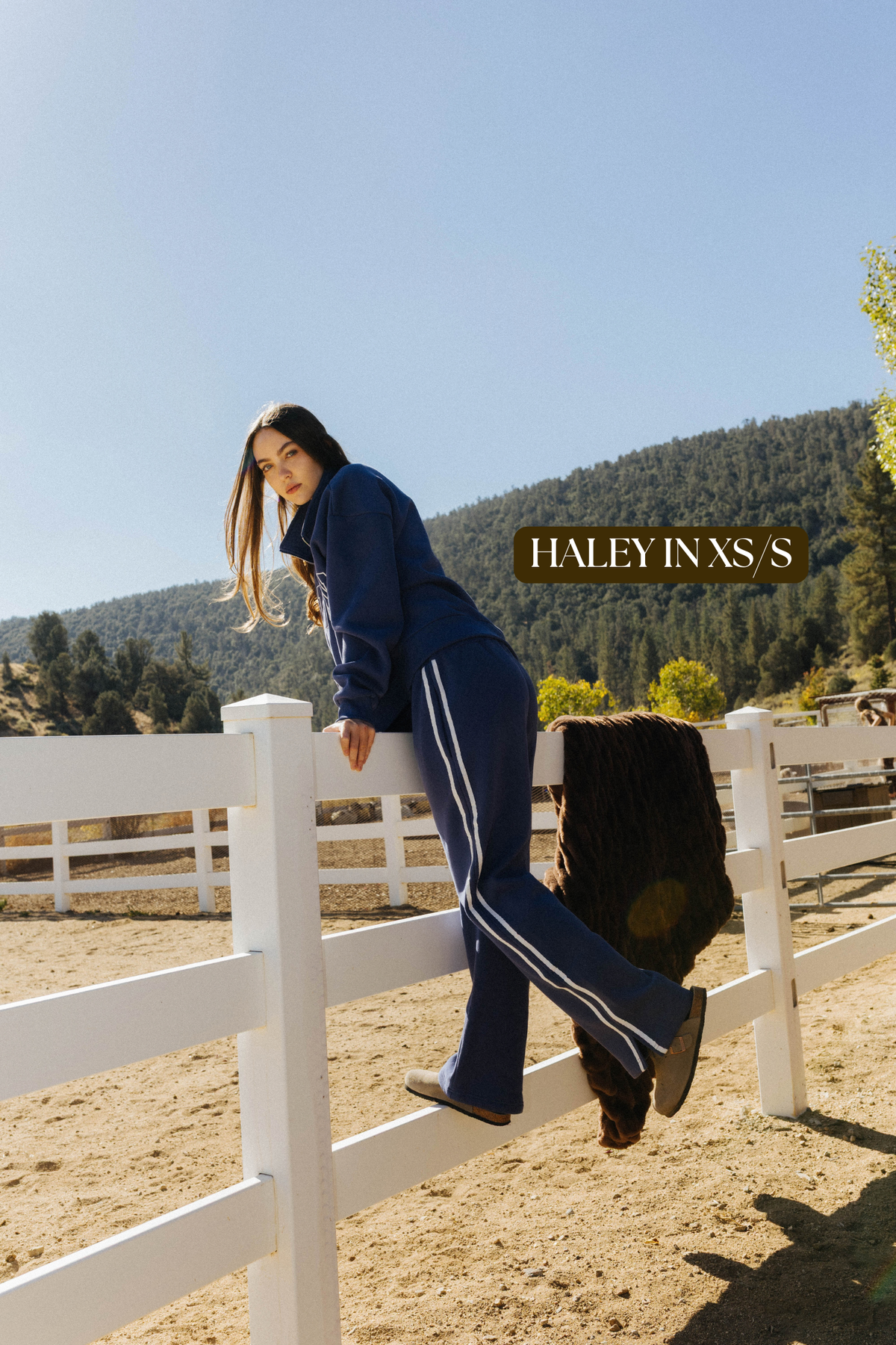 Sizing photo: Haley in XS/S wearing blue Homebody sweatshirt and sweatpants.