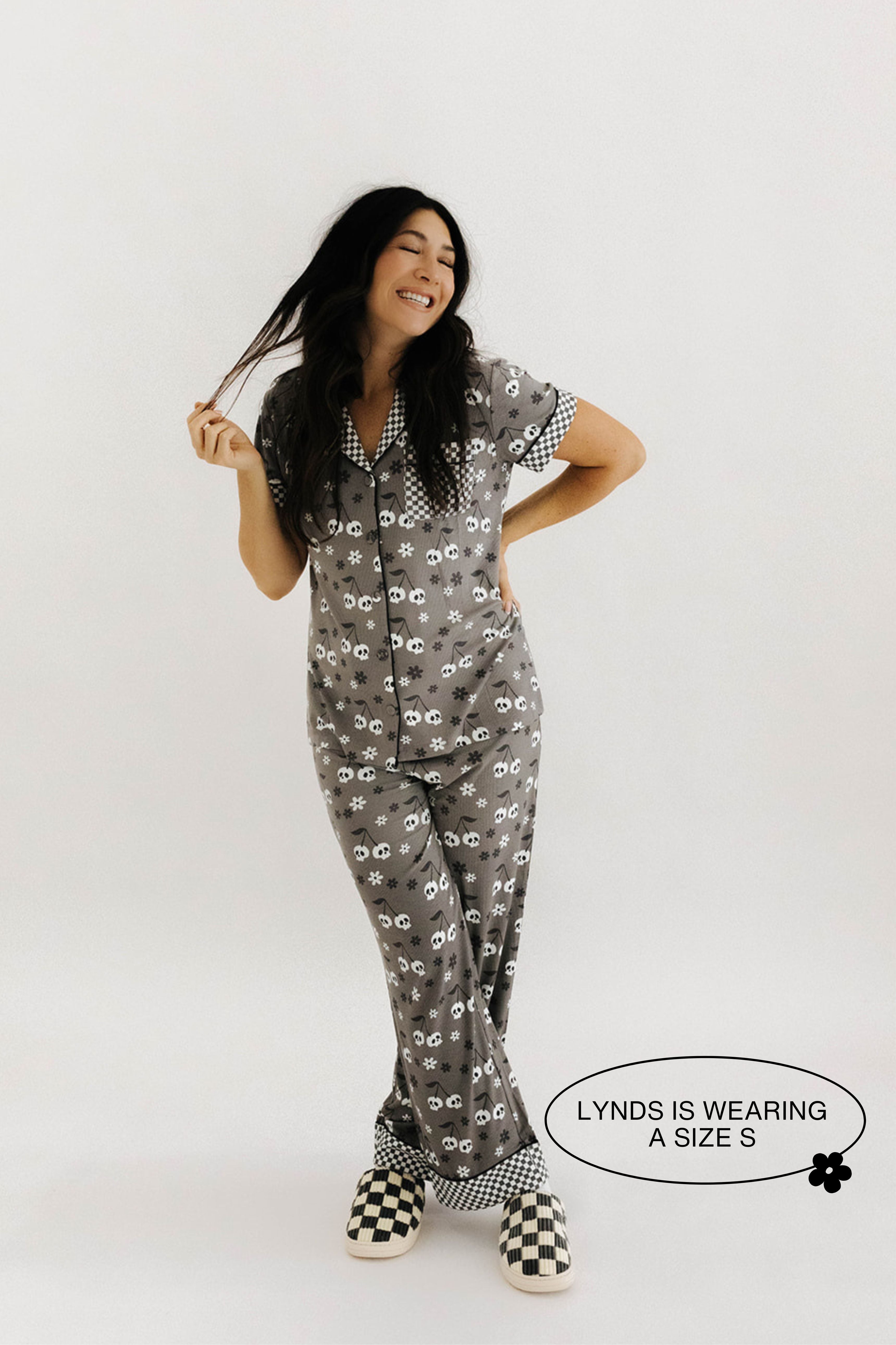 model lynds wearing a size small in the skeleton pajamas