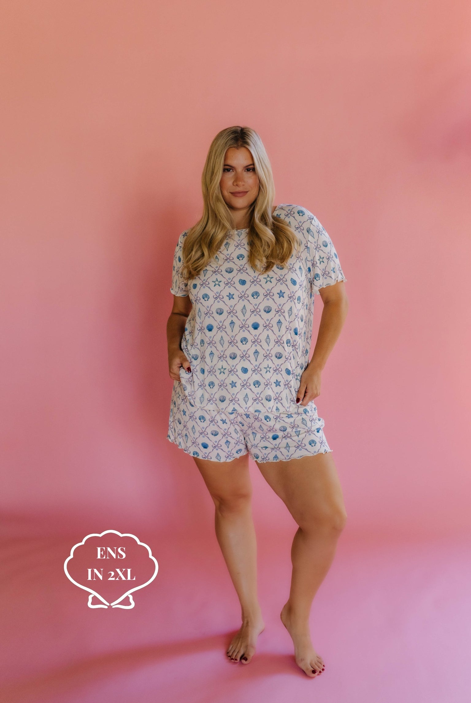 Woman wearing a shell pj set in size 2xl