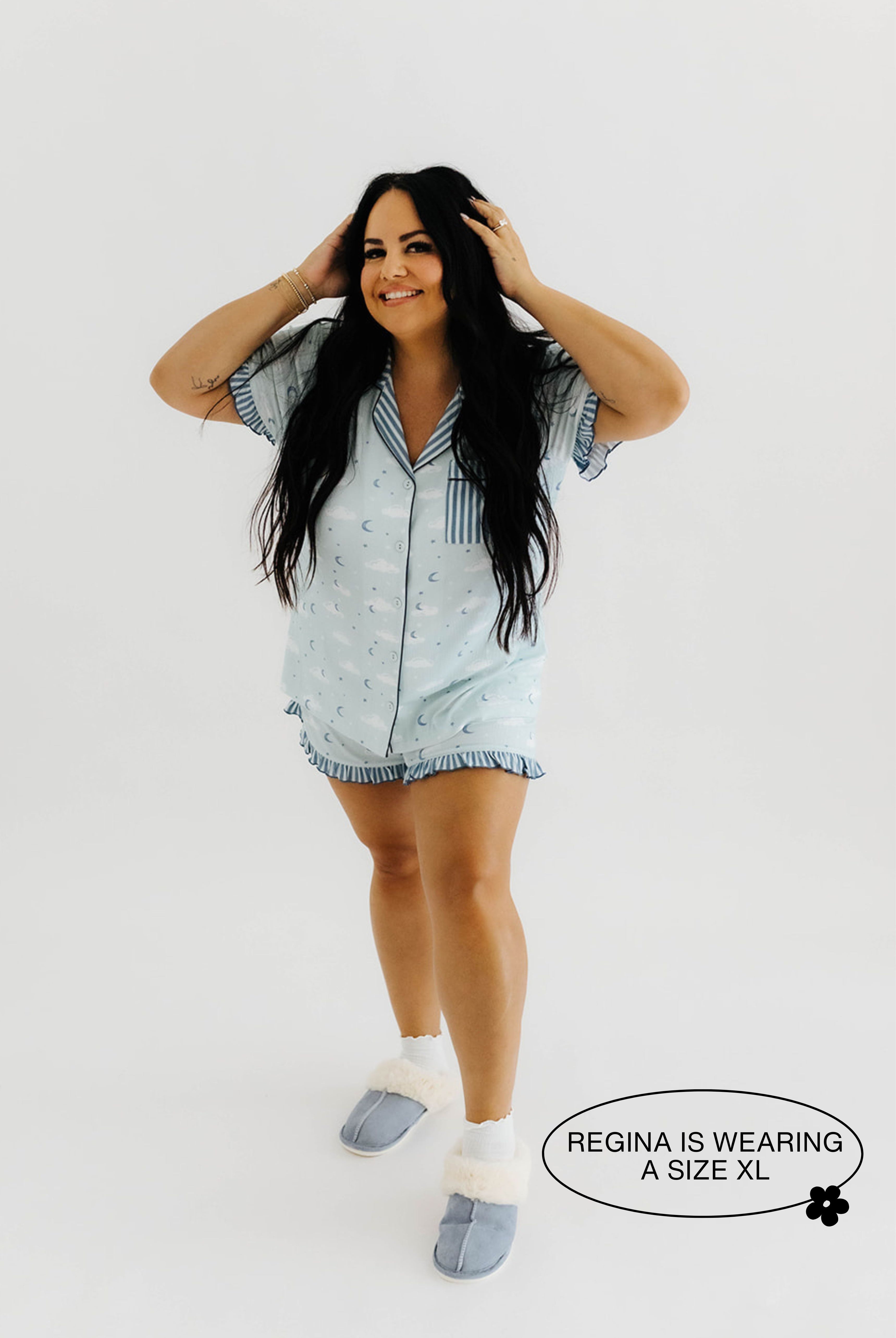 model regins smiling with hands on head wearing size extra large in cloud ruffle pajamas