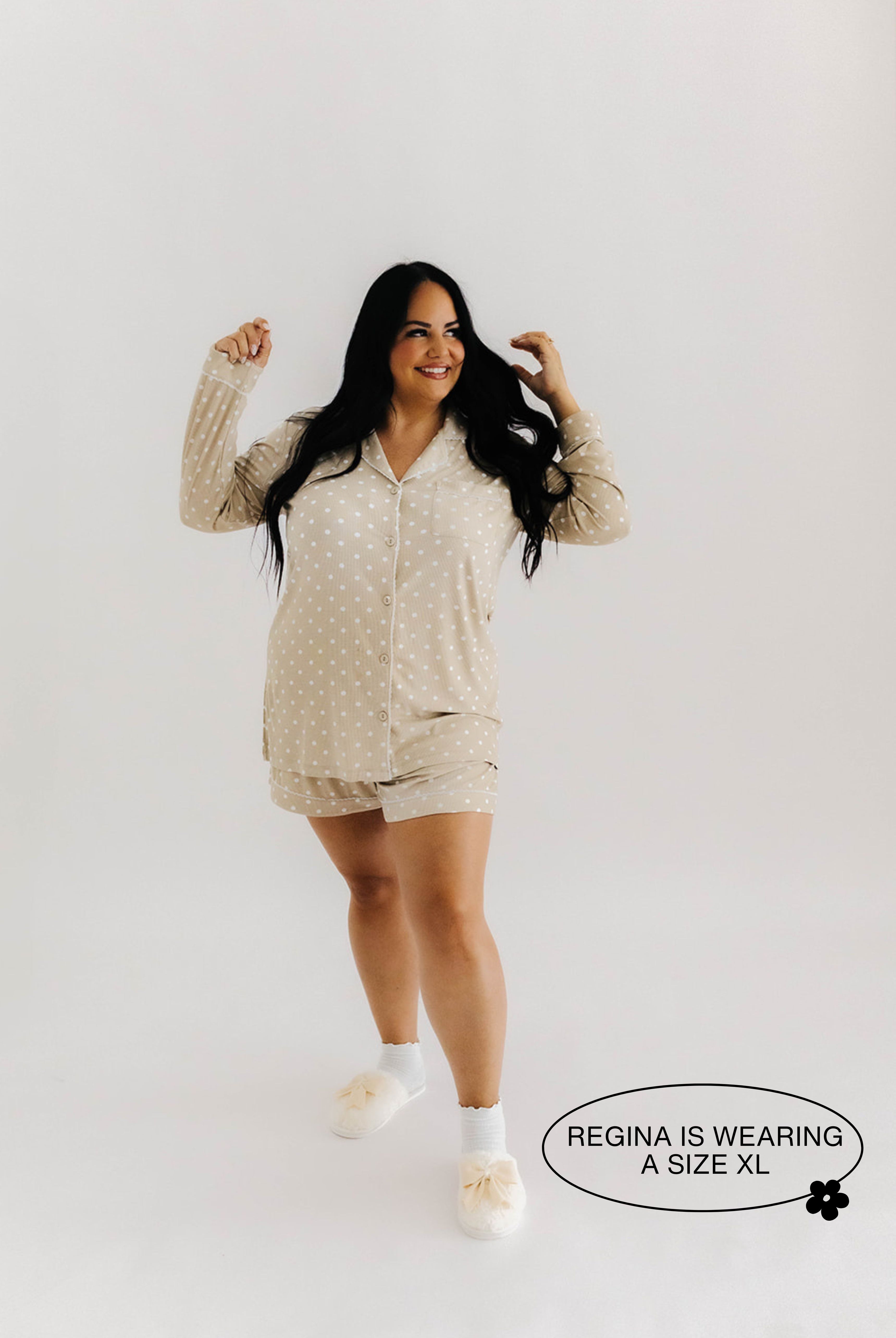 model regina smiling wearing size xl in lace polka dot pajamas