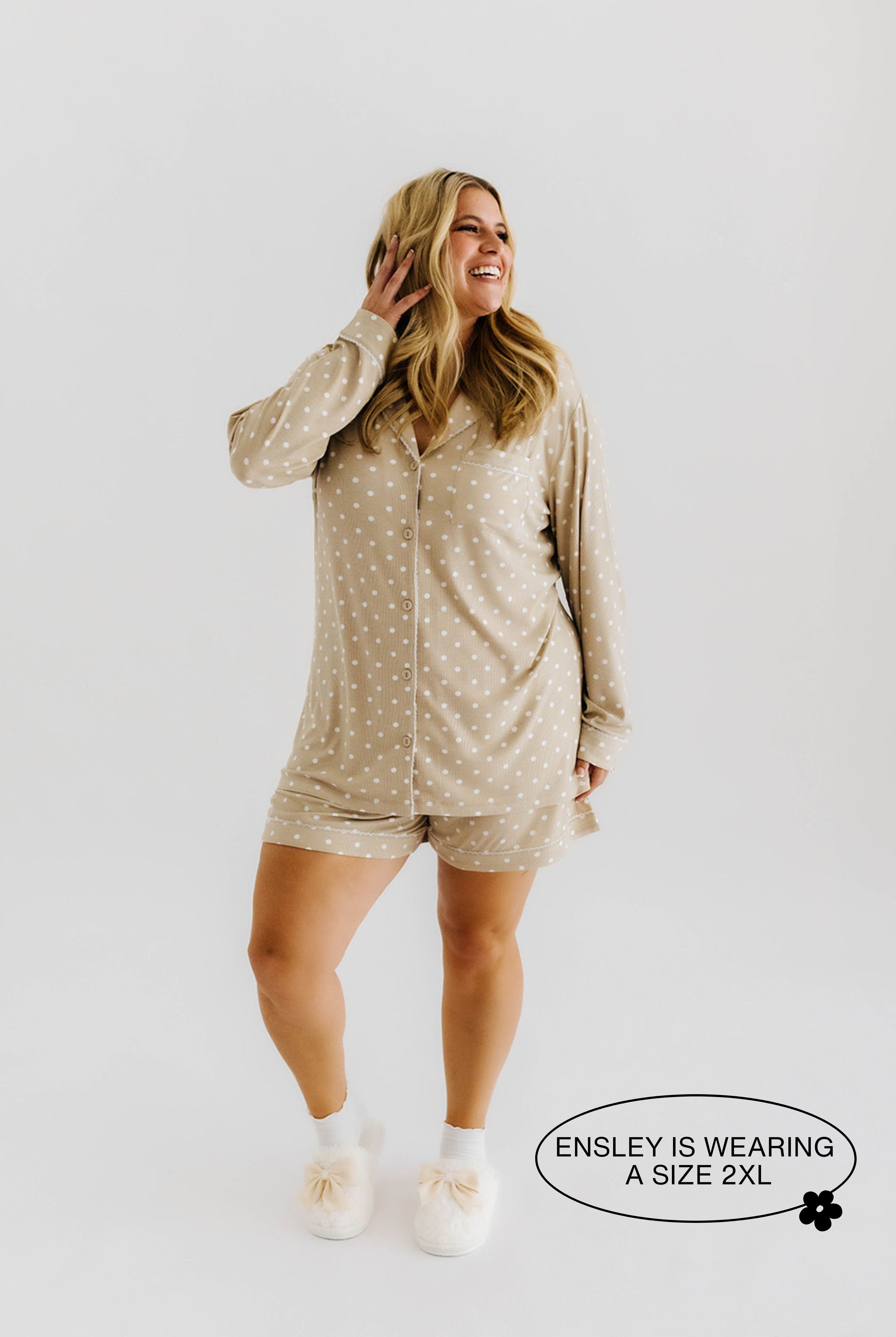 model smiling wearing 2xl in polka dot pajamas