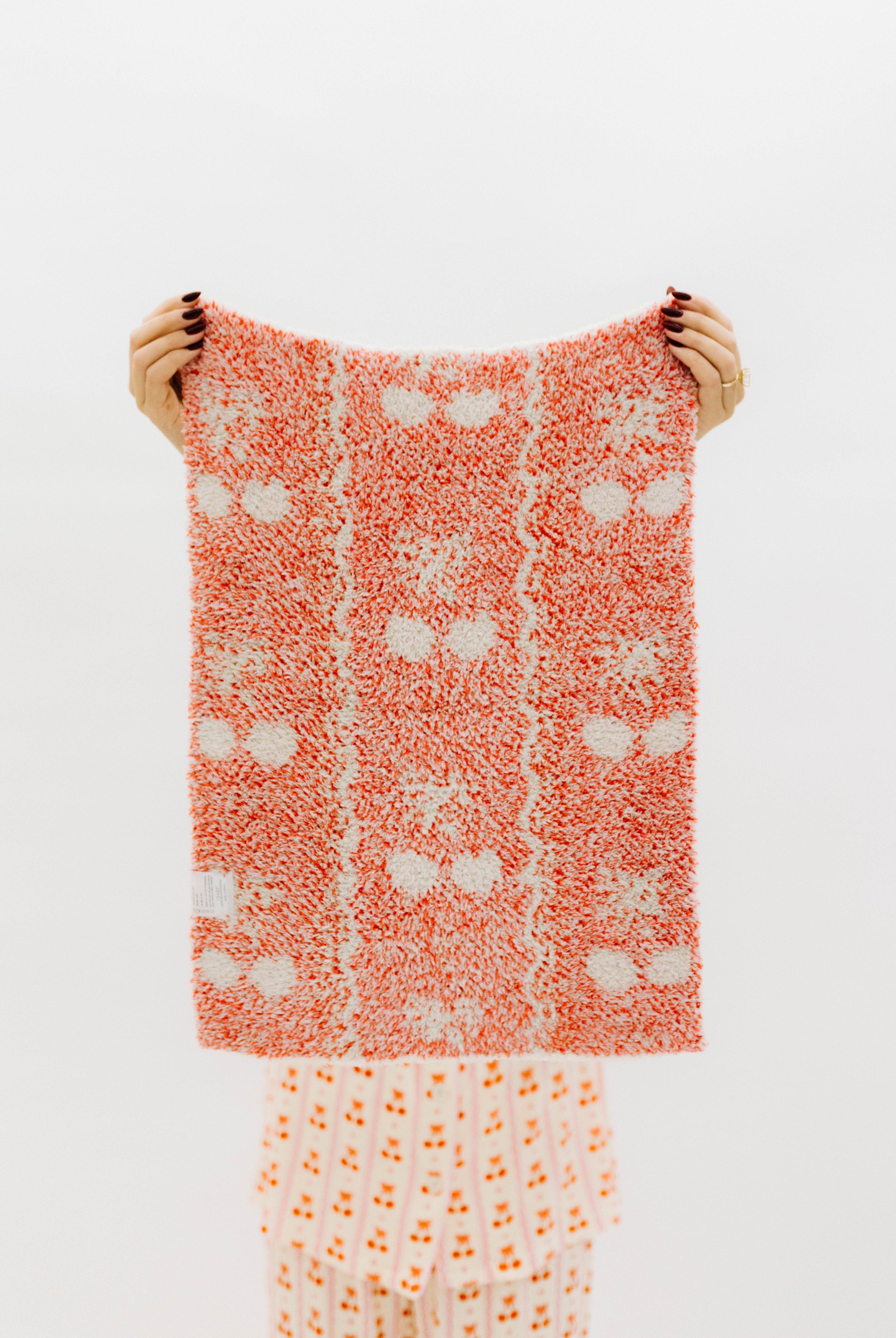 back of the blanket showing mostly white and red