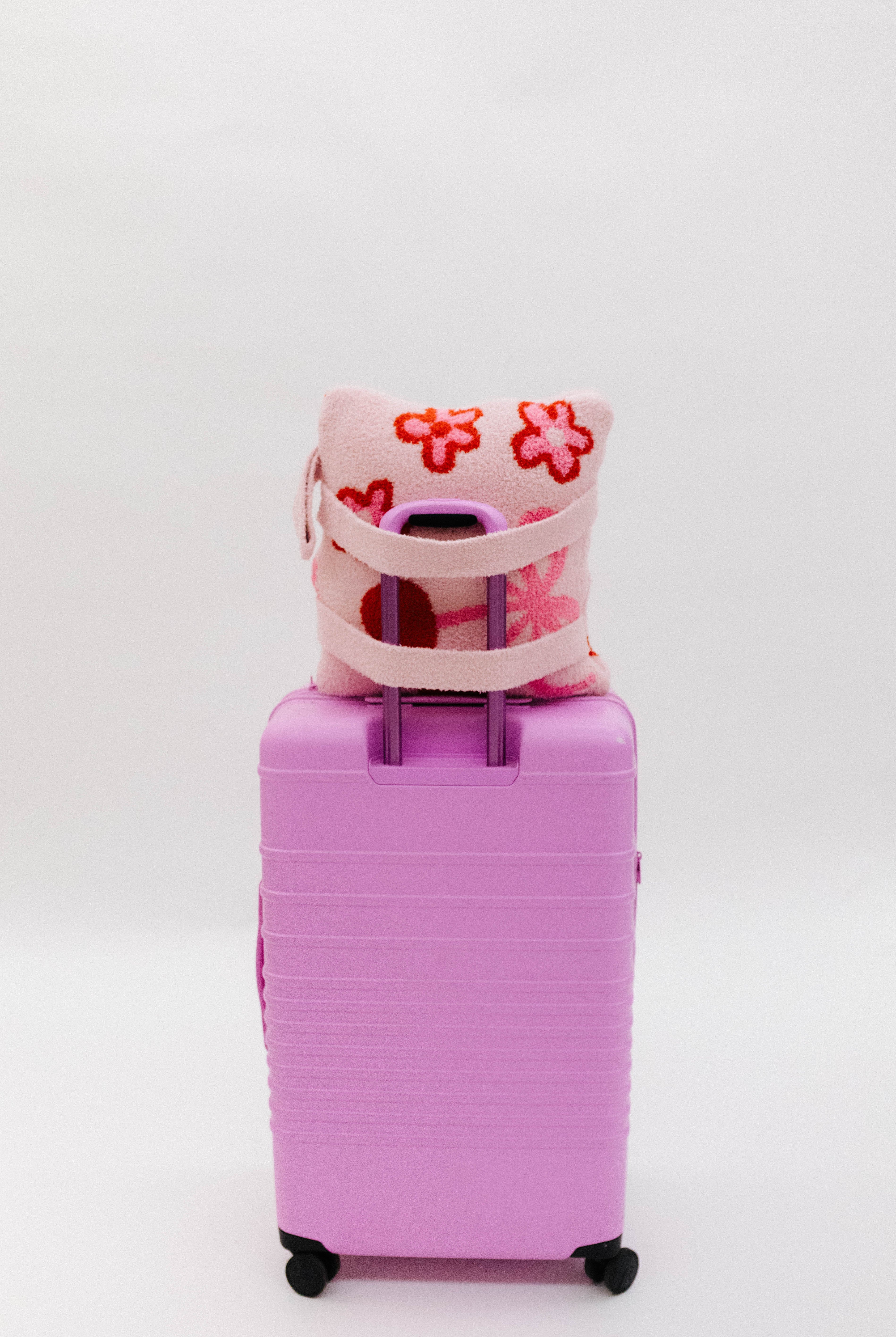 Love you quillow on pink suitcase
