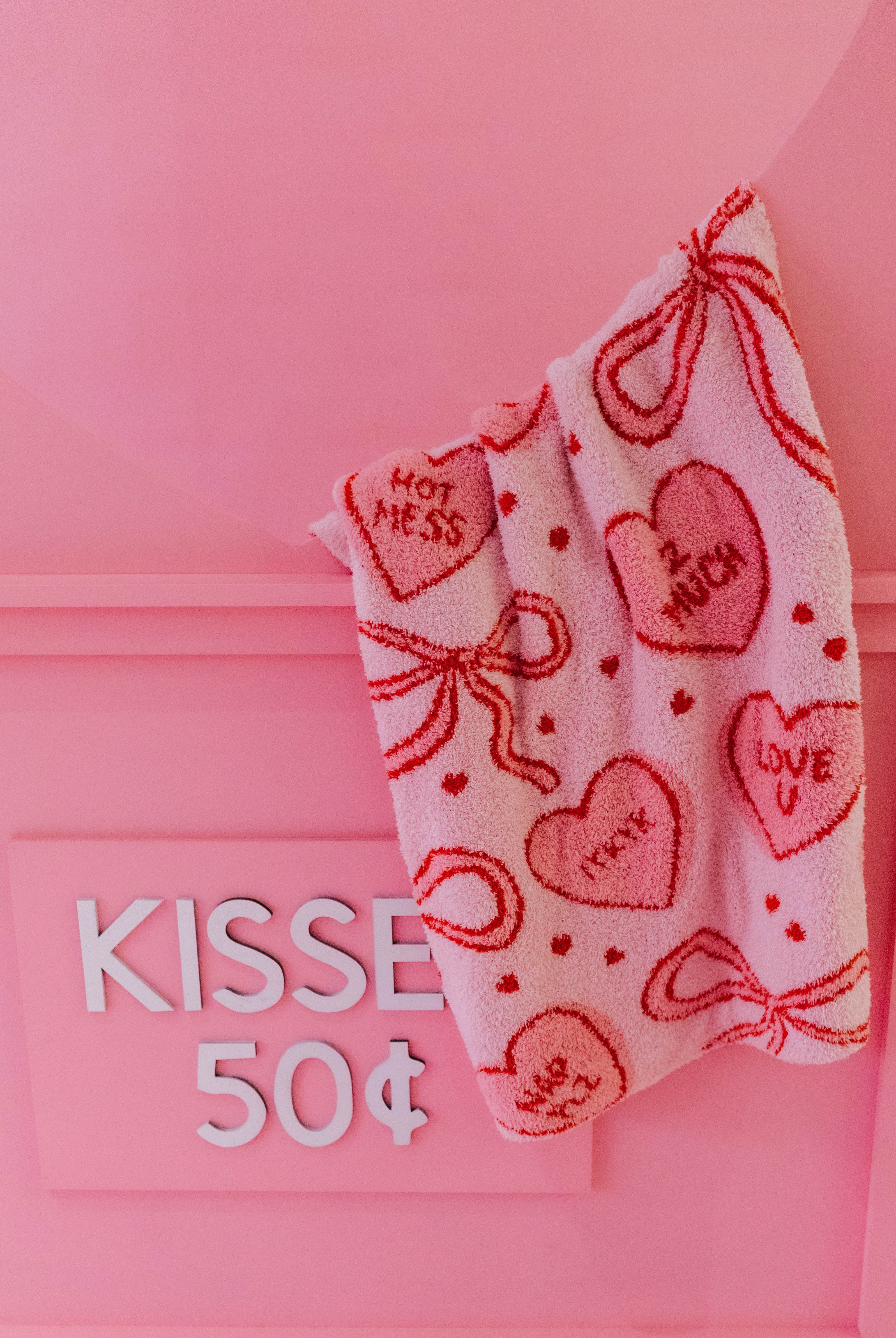 Blanket with bow and heart pattern that says hot mess, 2 much, IYKYK, Love U, Nap PLZ