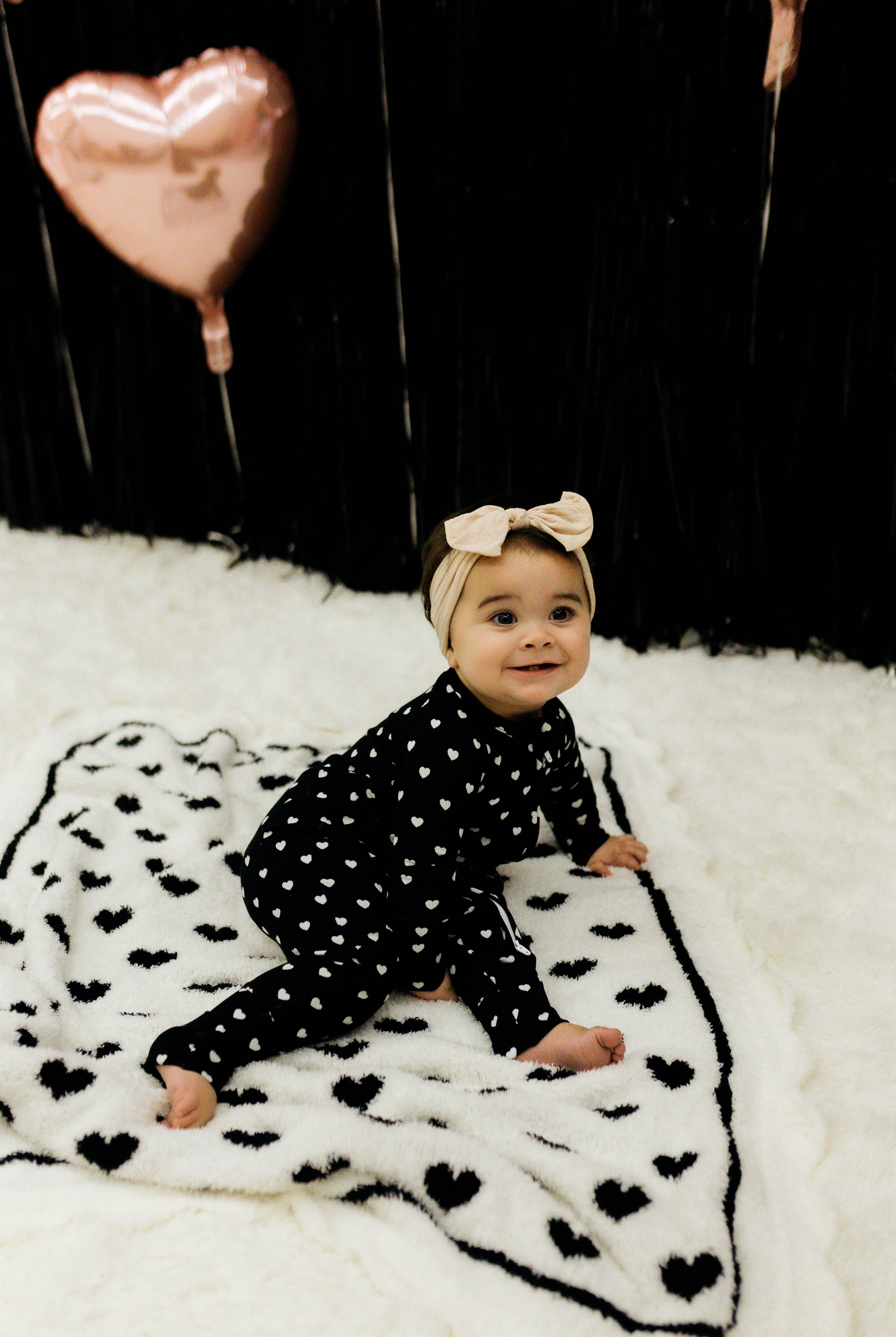 Baby on top of the blanket