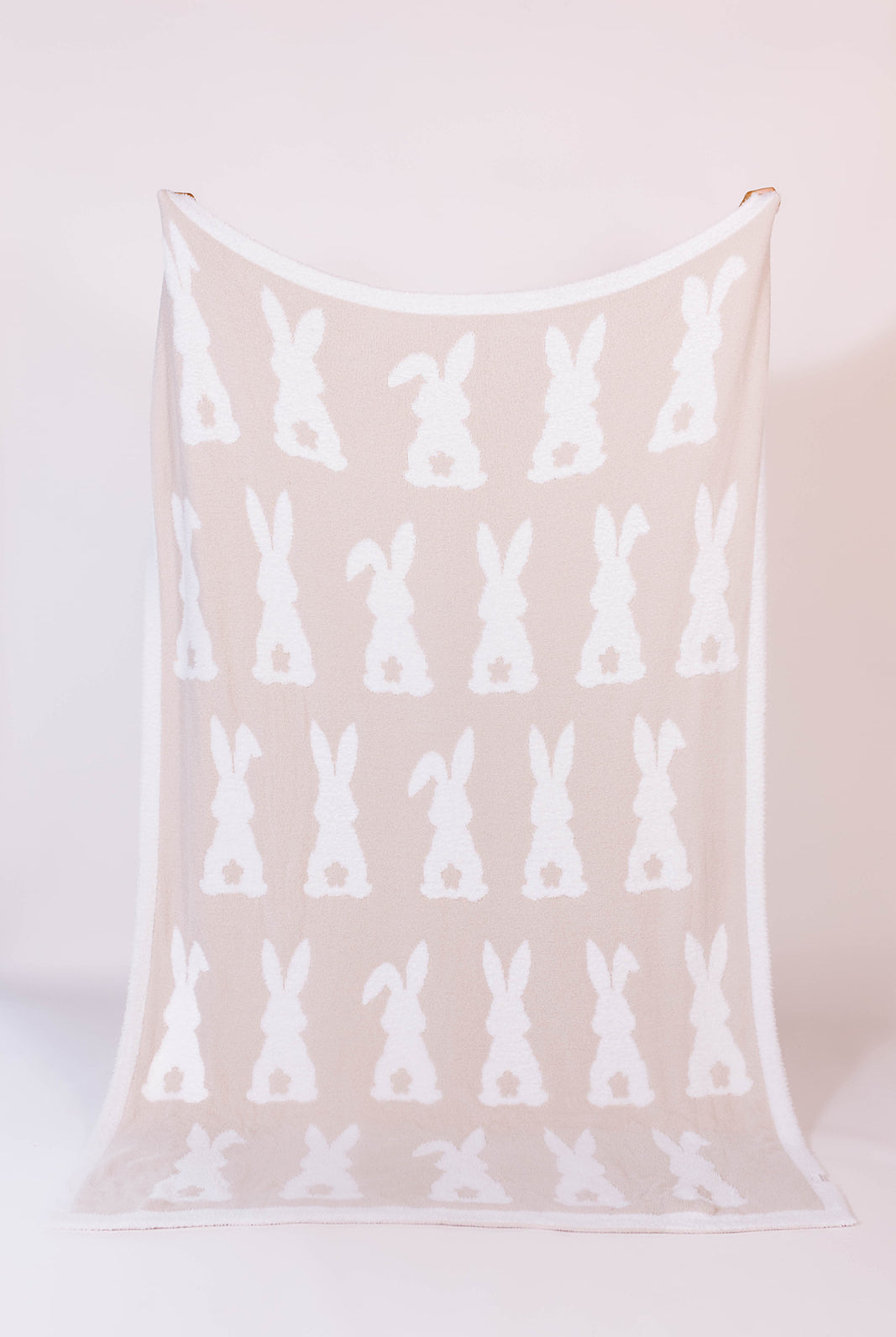 60*80 blanket with white bunny pattern on a sand
background