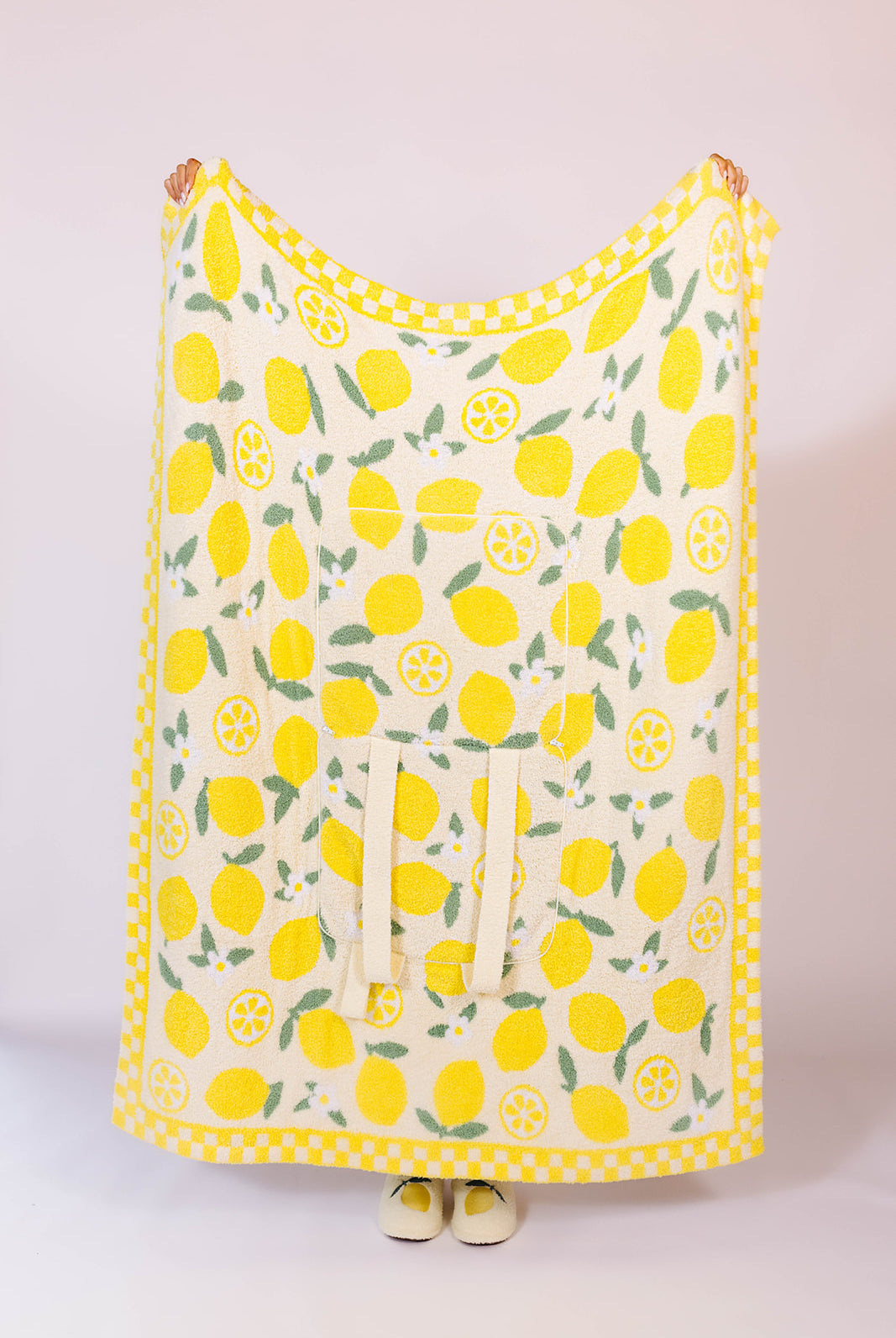 holding the quillow up to show the front side