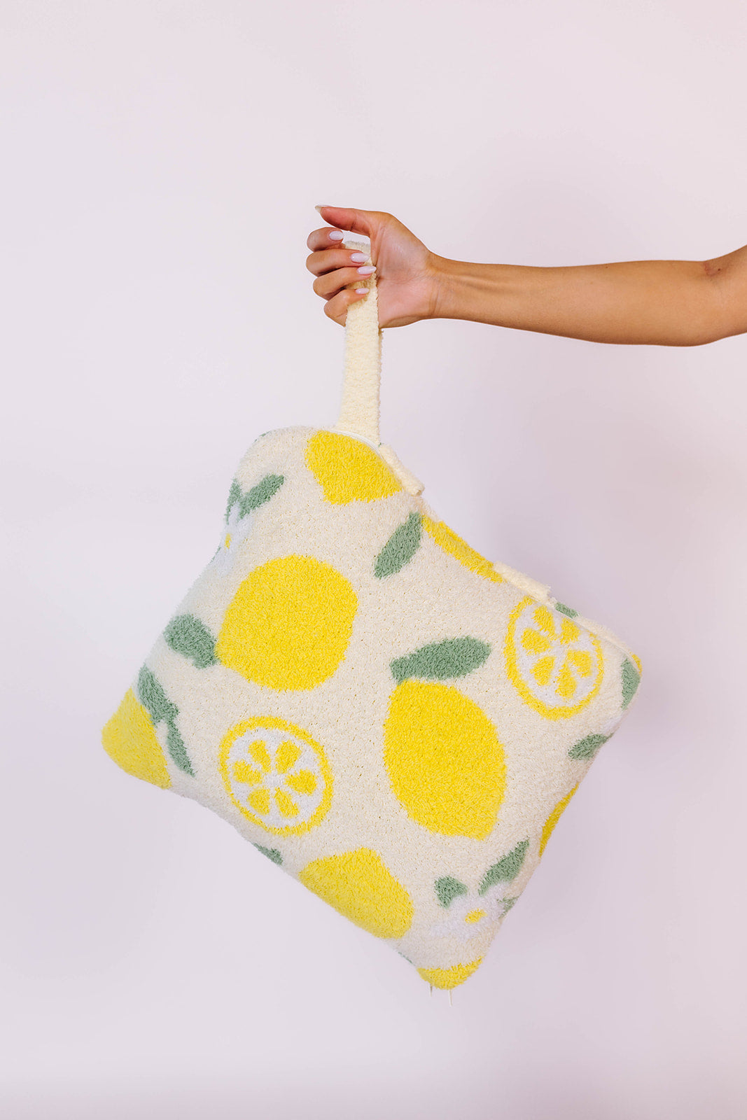 holding the quillow by the wristlet