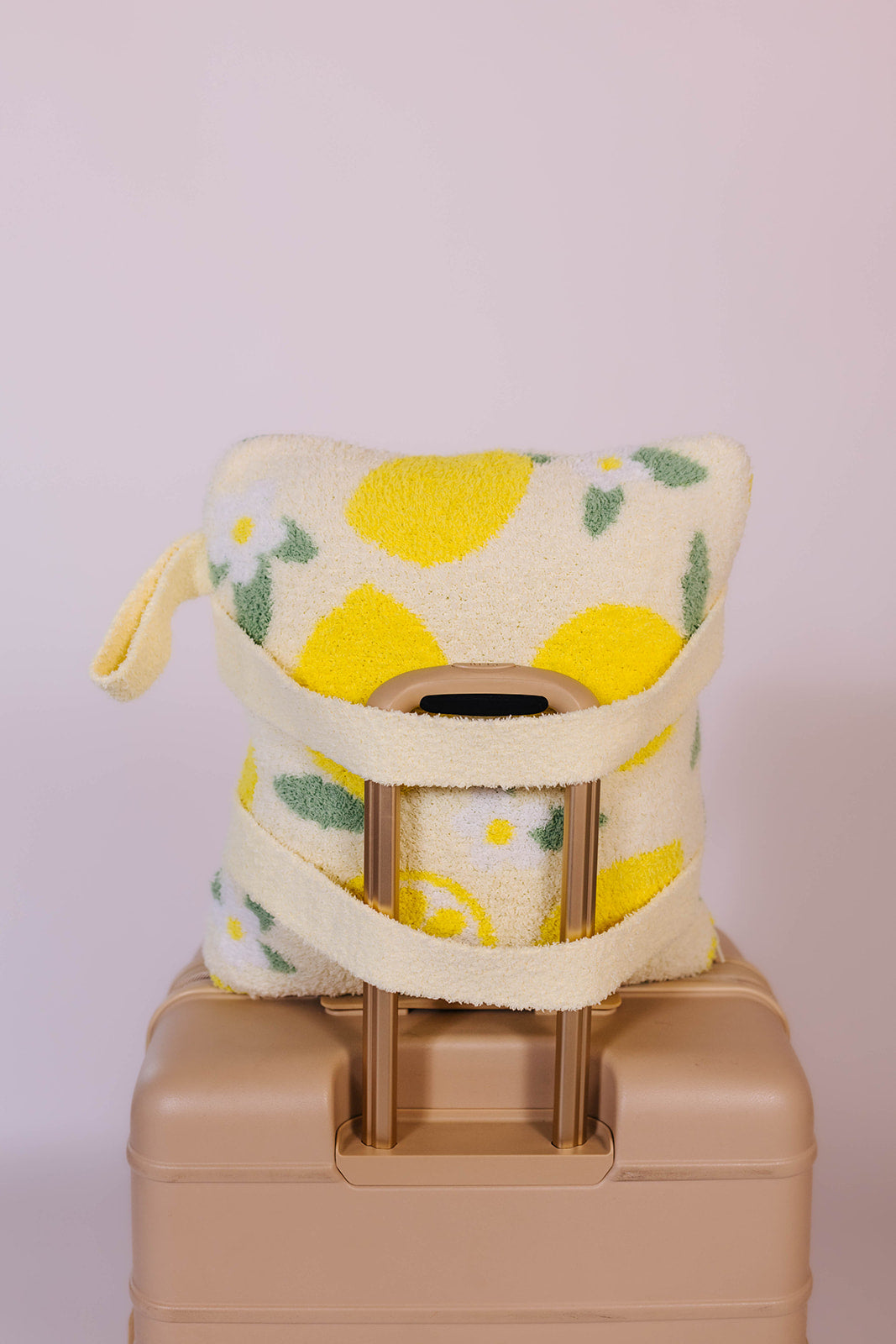 showing the quillow on the suitcase from a different angle