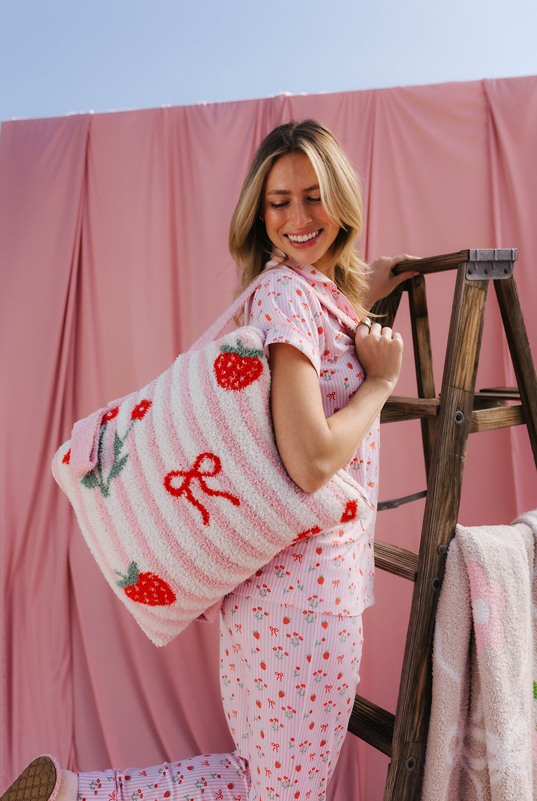 bri holding the quillow on her back