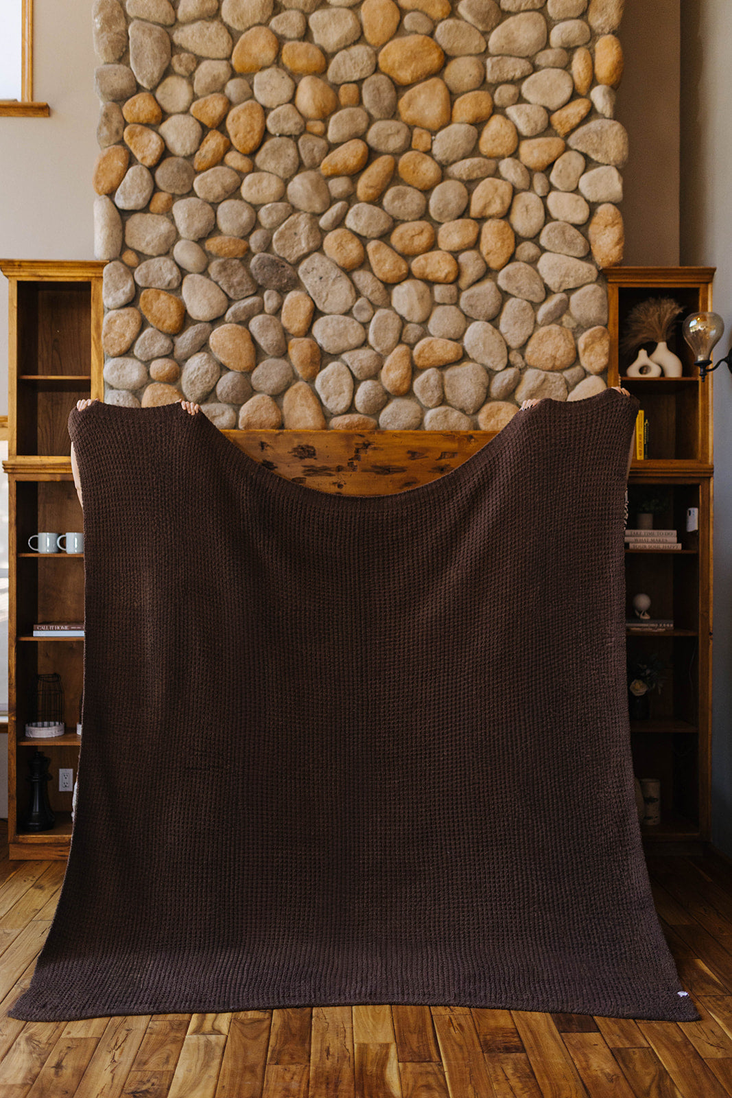 Brown waffle blanket held open at full size.