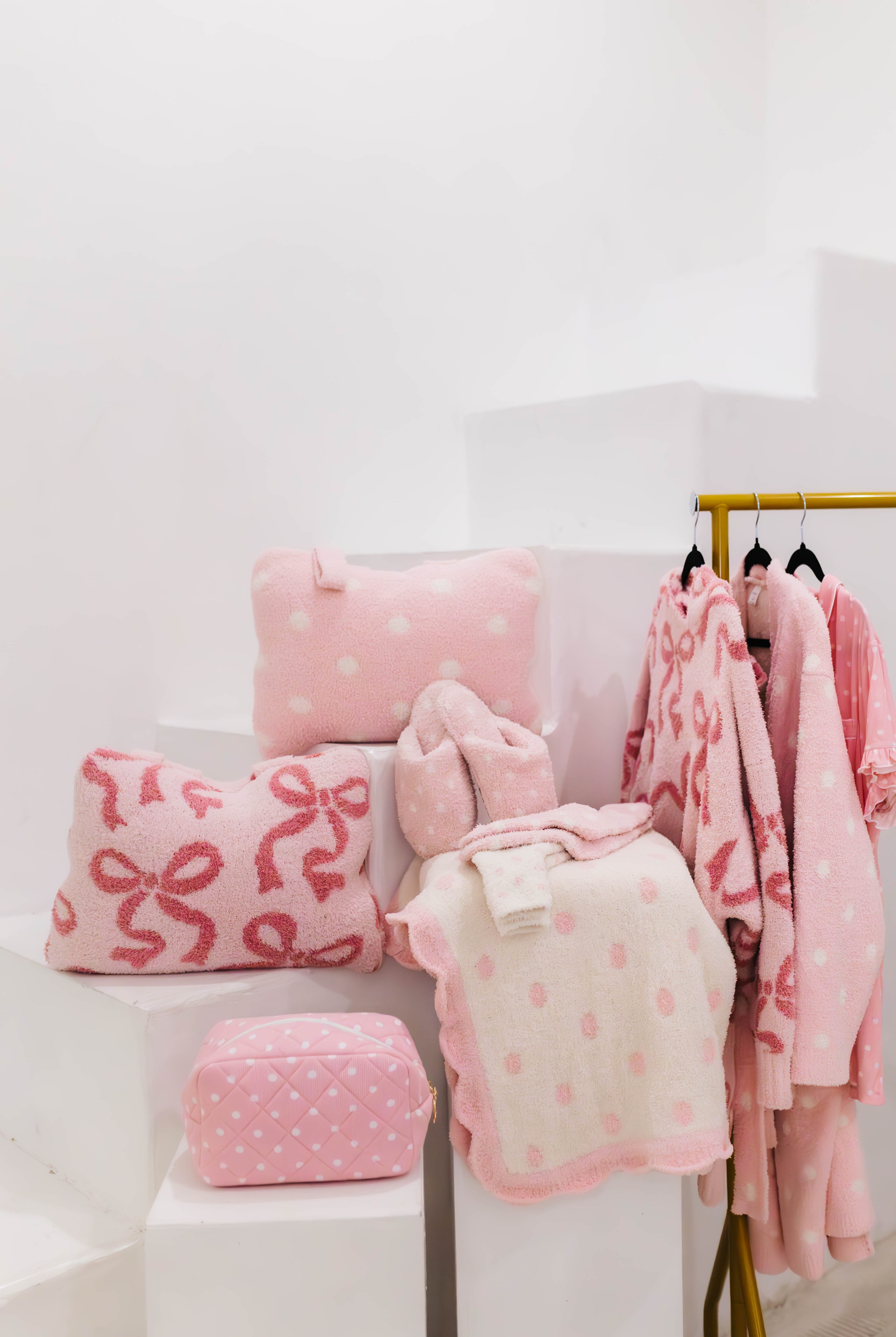 mixture of different pink items some on pillars and some hanging