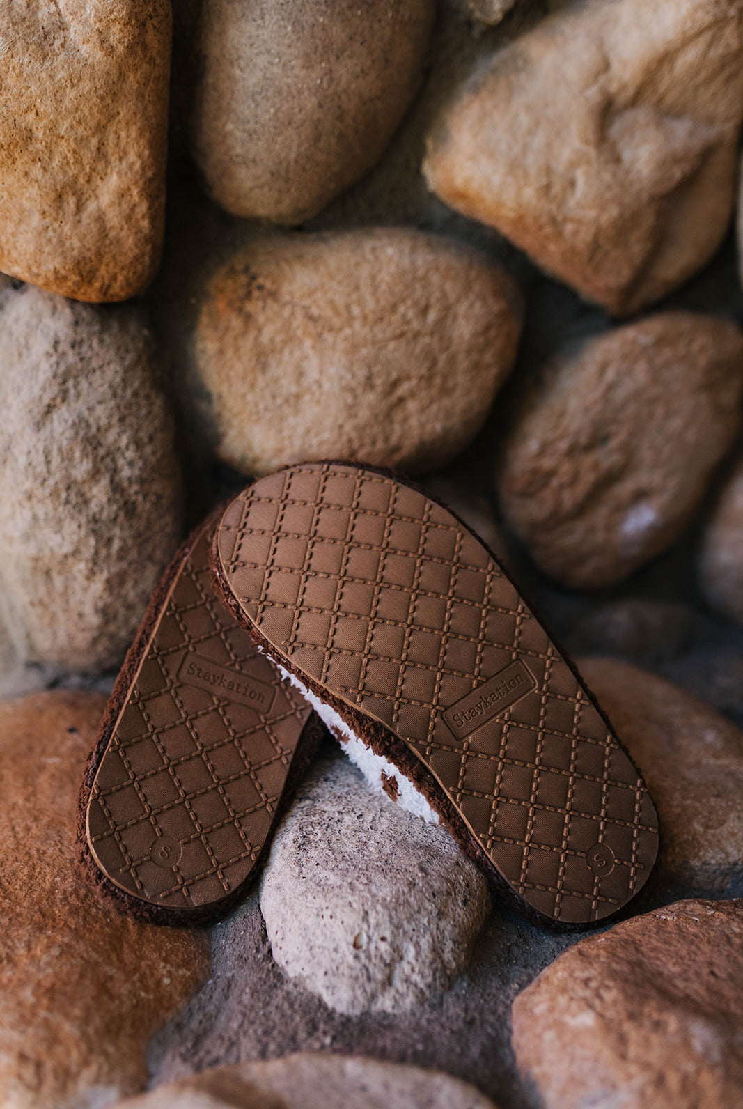 Brown textured soles of the polka dot slippers.