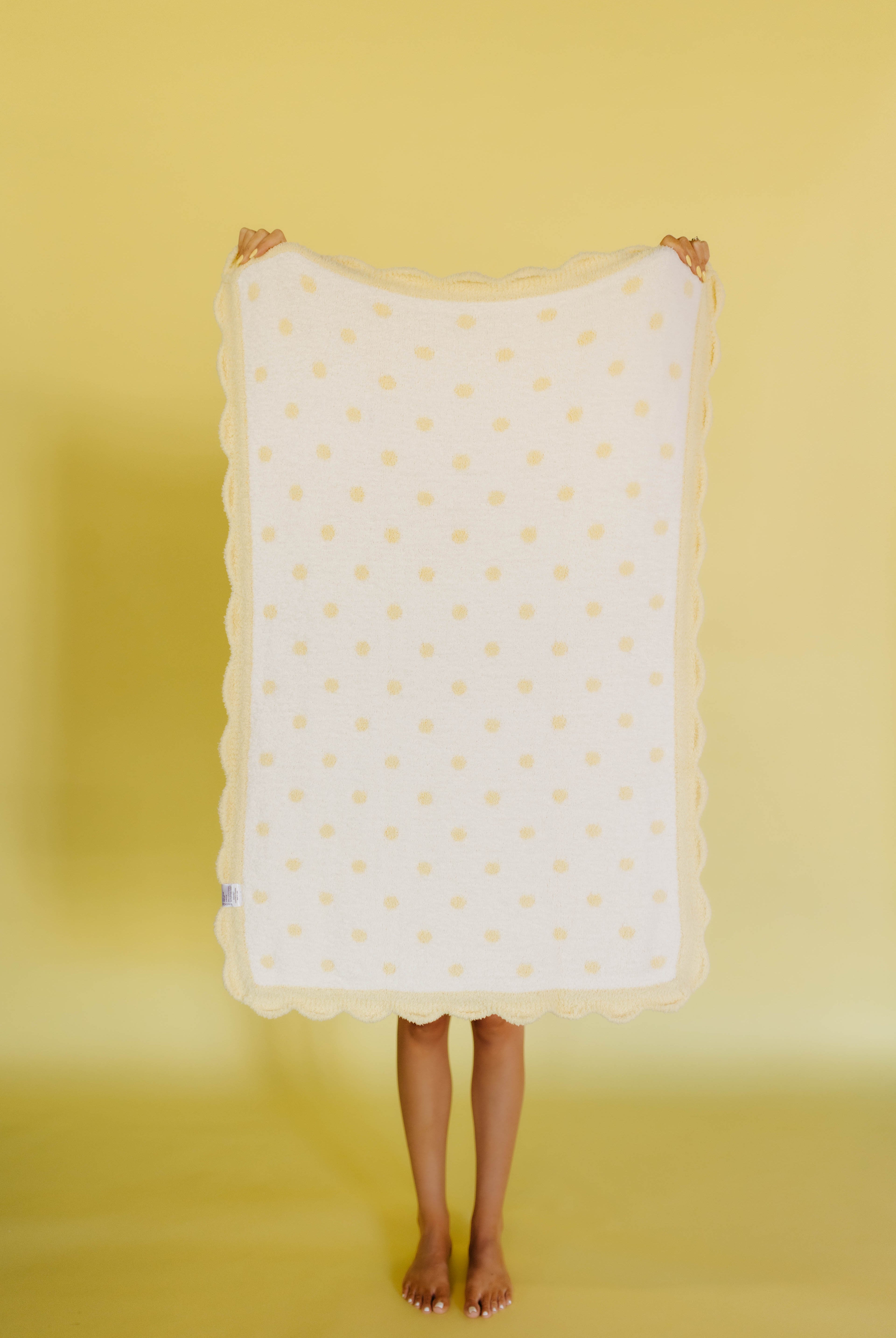 white side of the butter yellow polka dog blanket