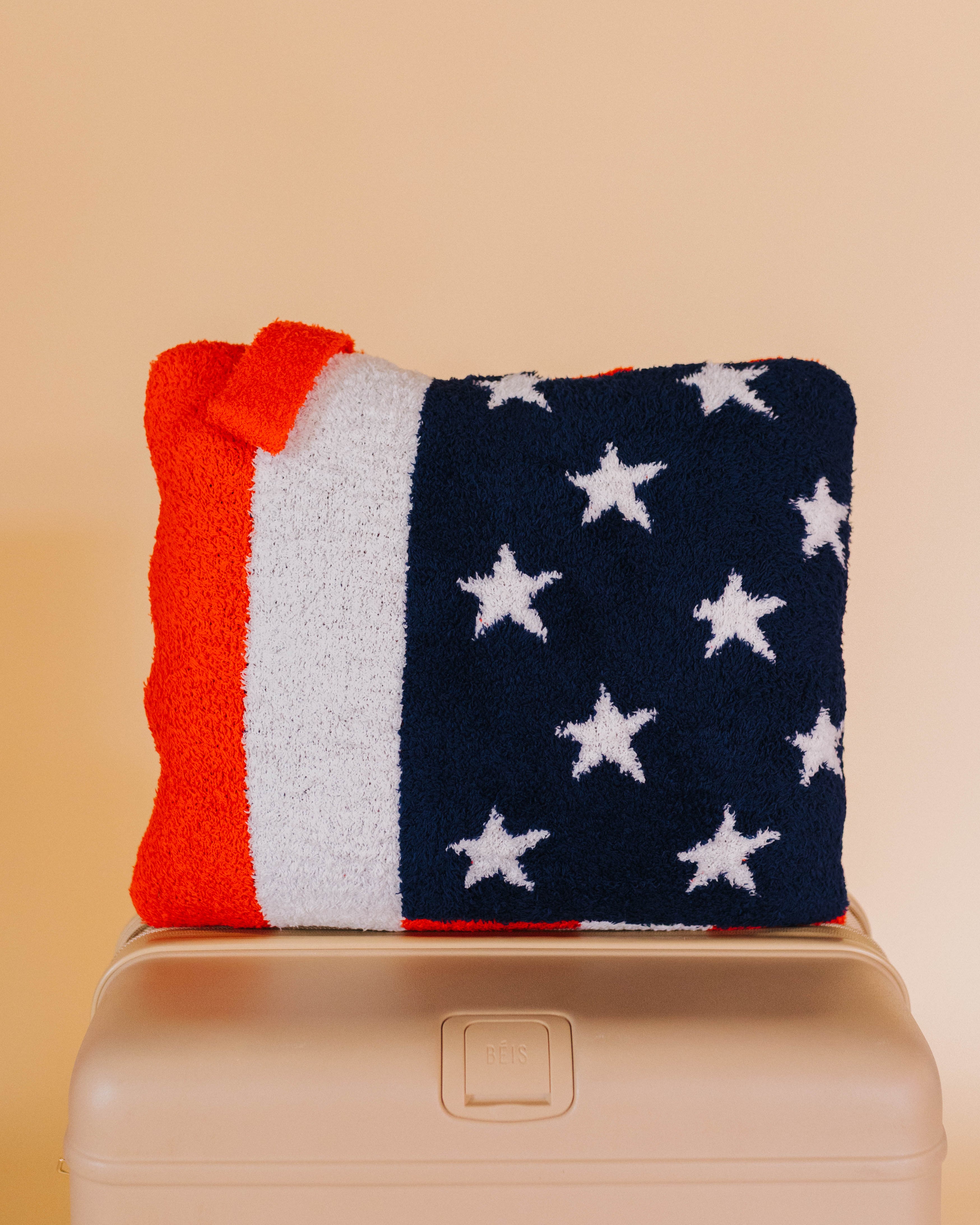 front of american flag quillow on beige bag
