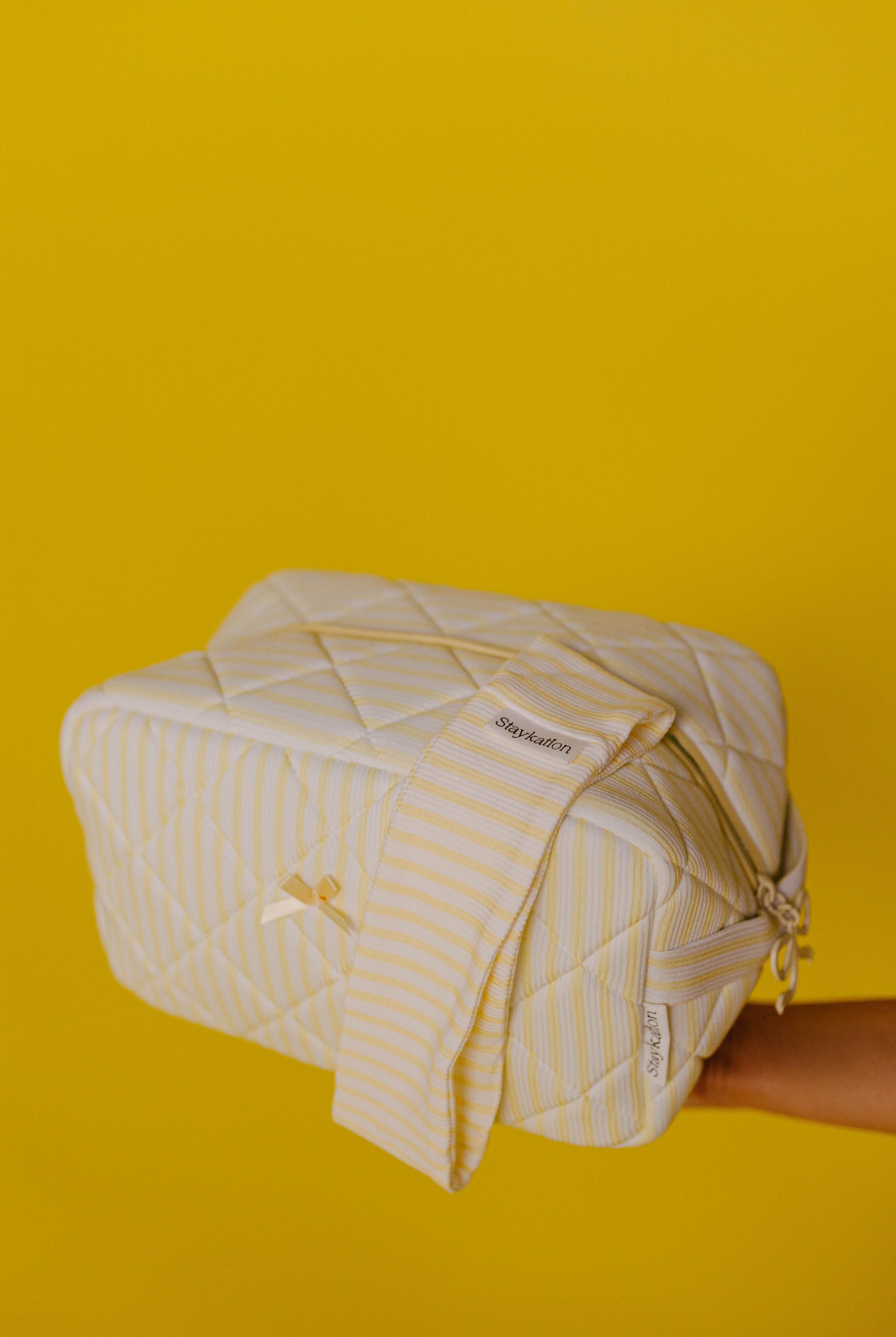 showing the cosmetic bag and headband combo