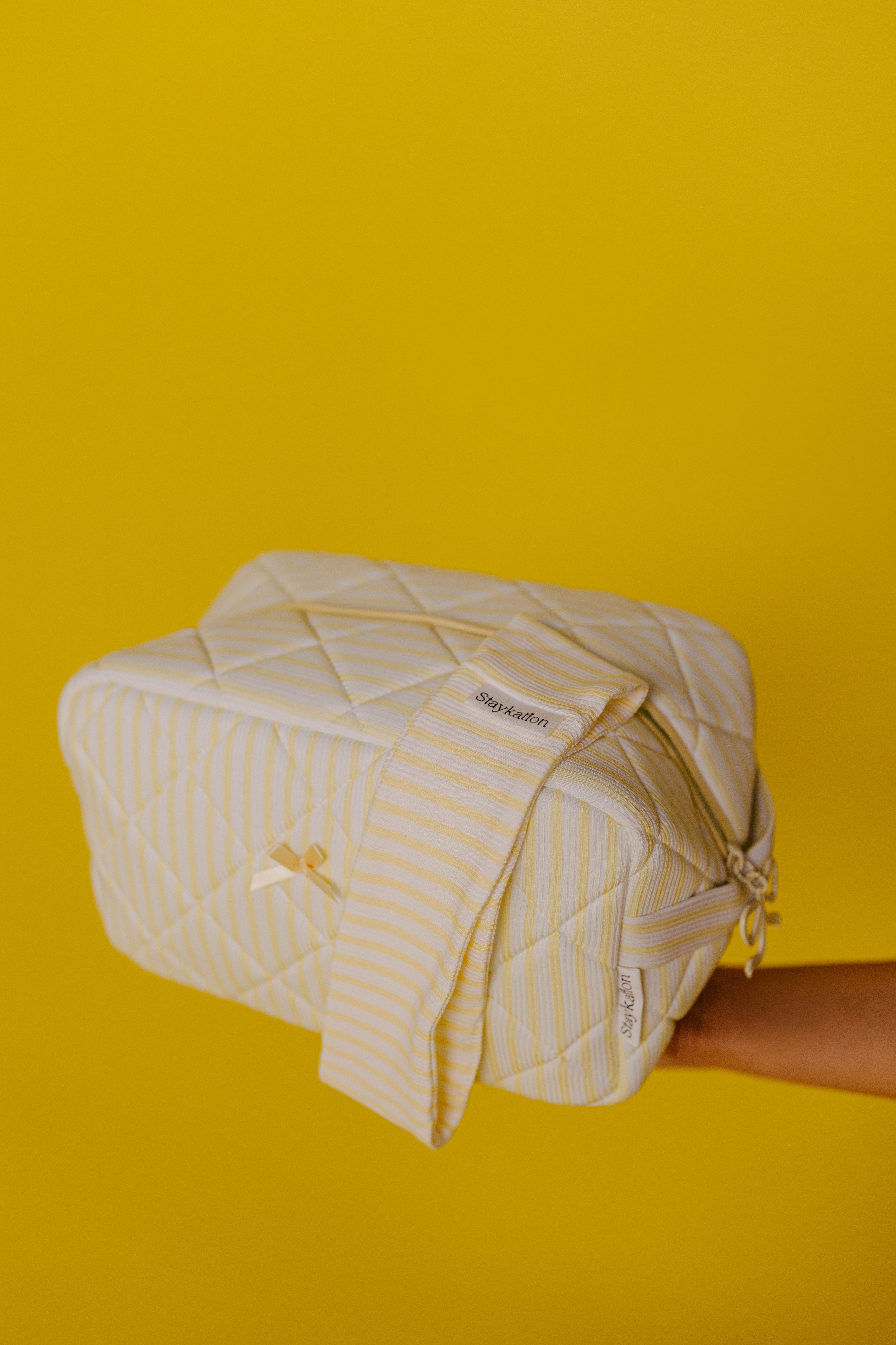 showing the cosmetic bag and headband combo