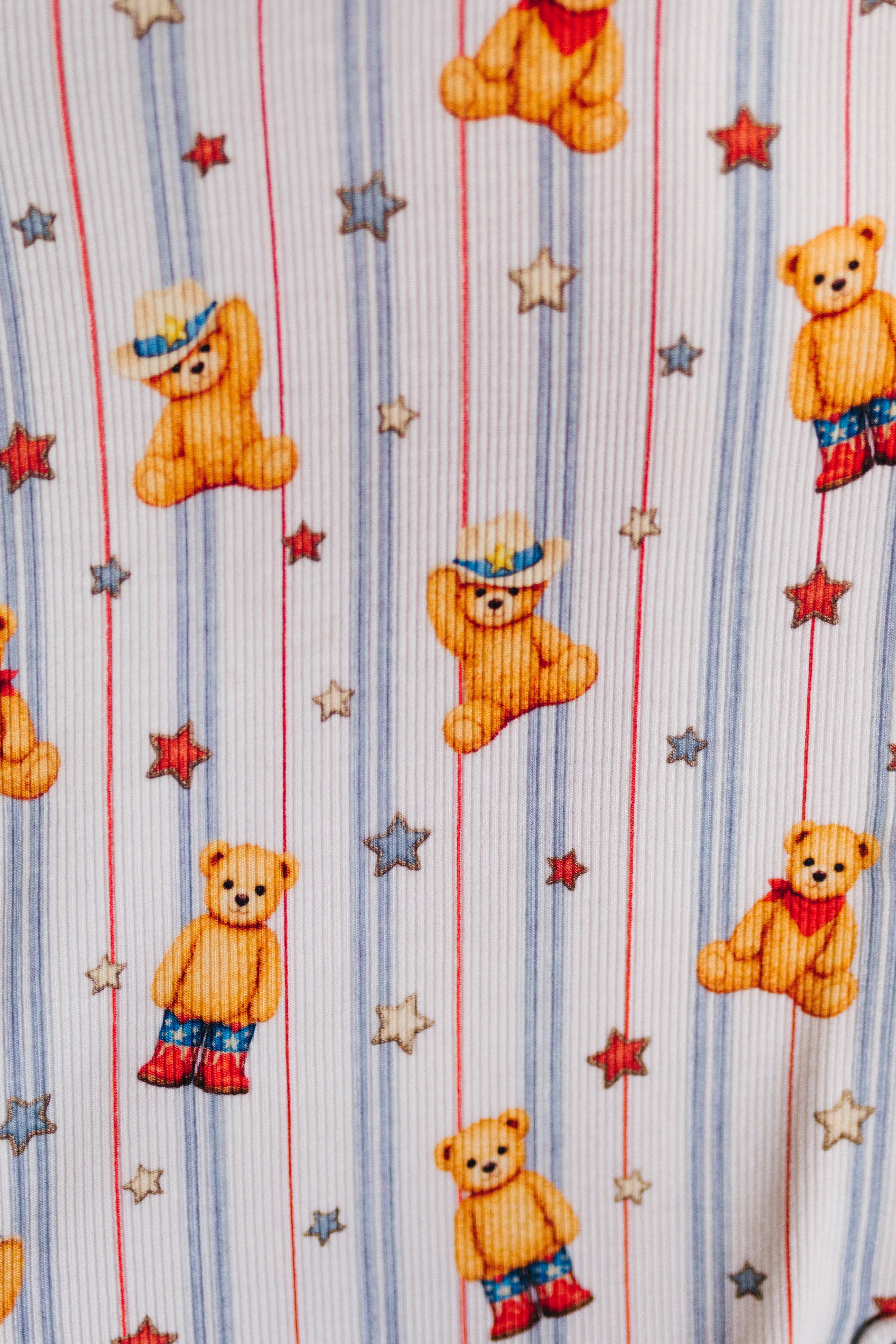 Pattern of teddy bears and stars on a striped background