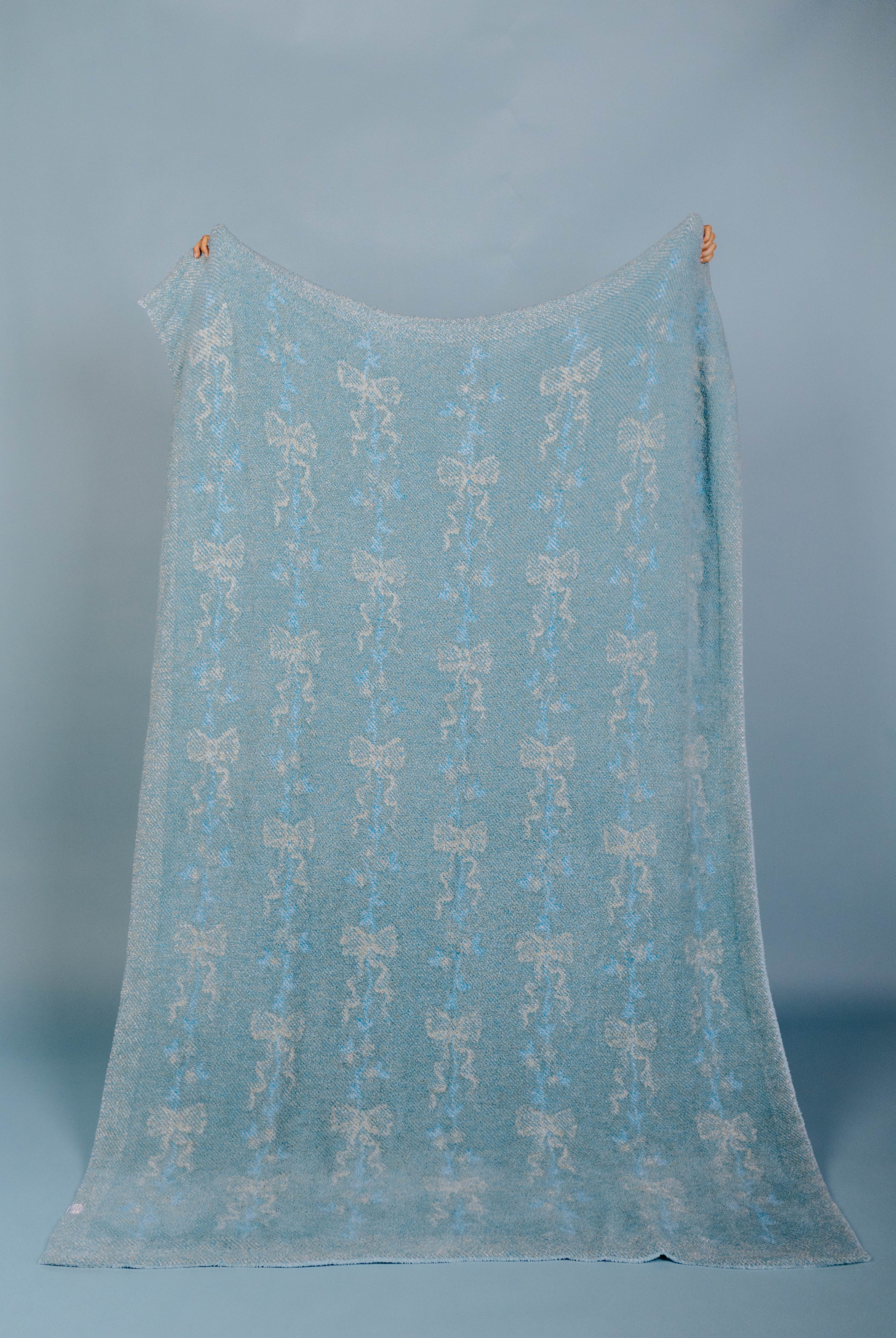 back of the blanket showing mostly blue weave