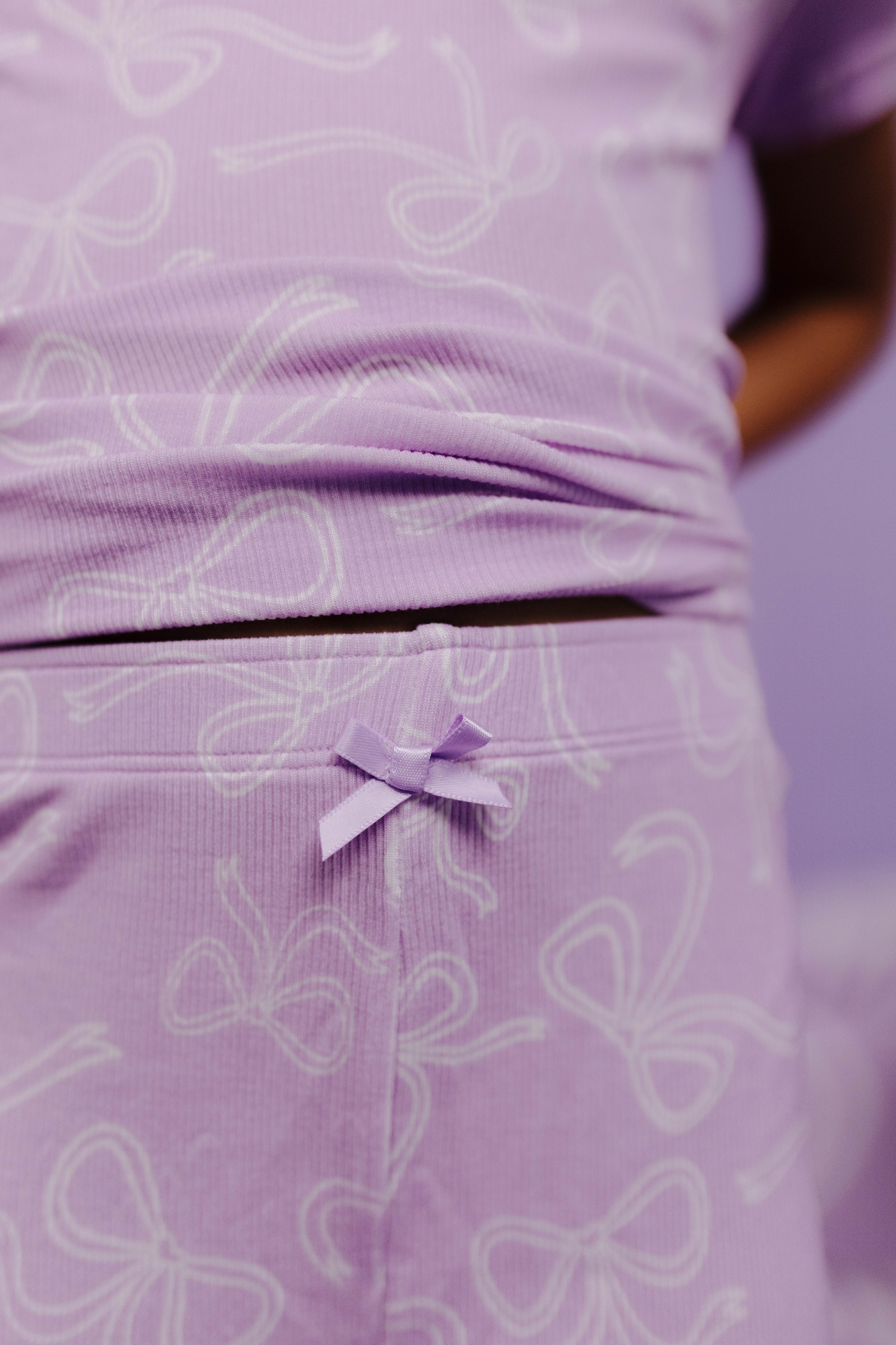 close up of purple bow detail on pj