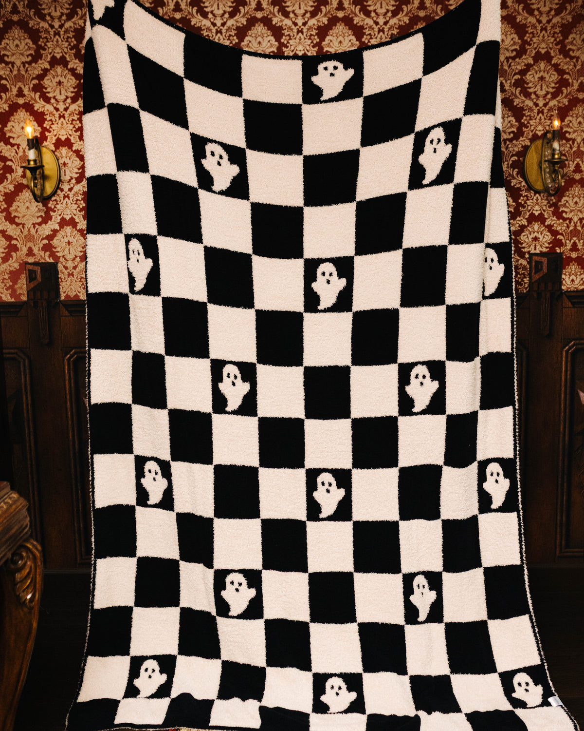 Ghost Check blanket held open to show the full pattern