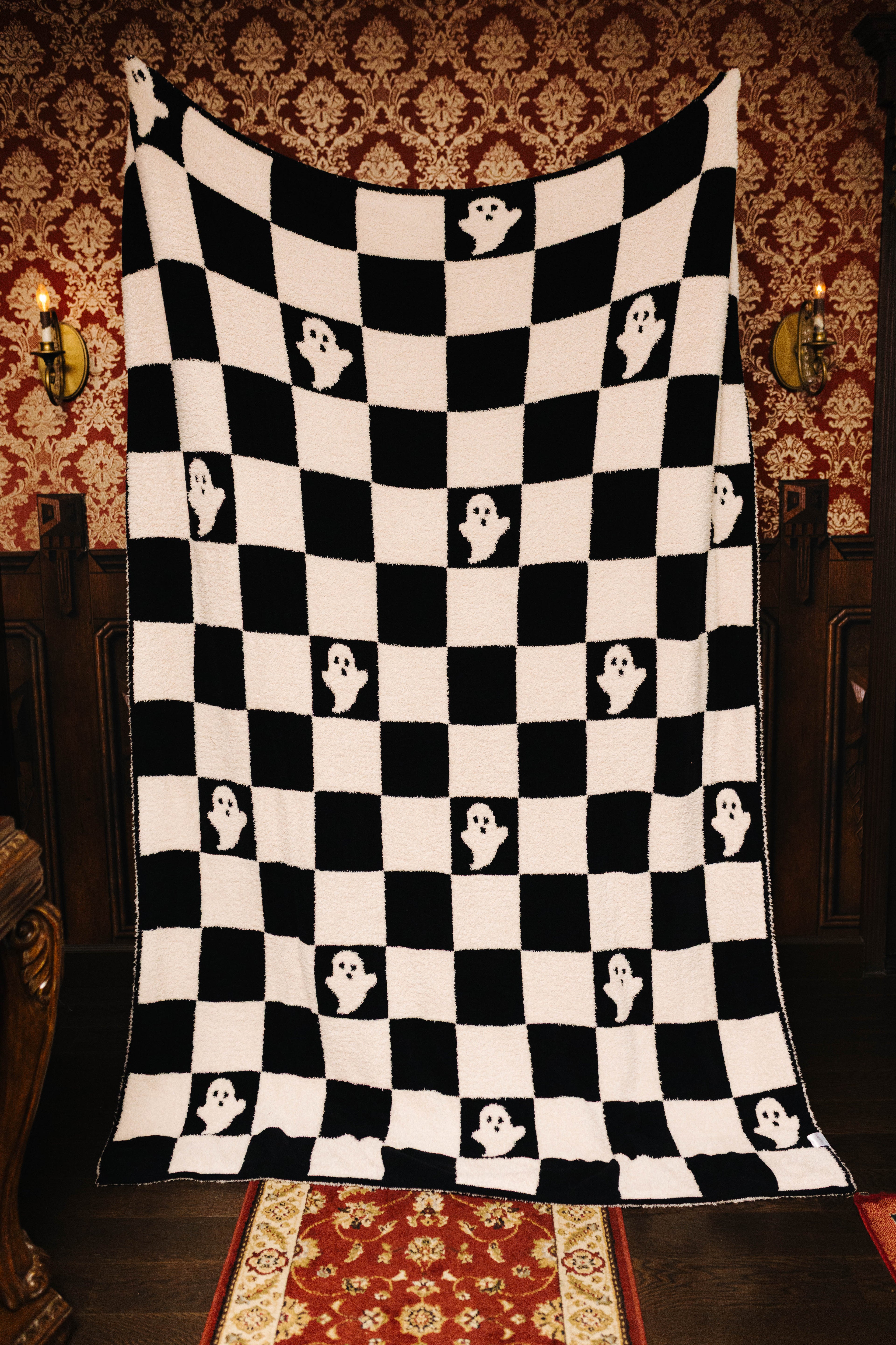 Ghost Check blanket held open to show the full pattern