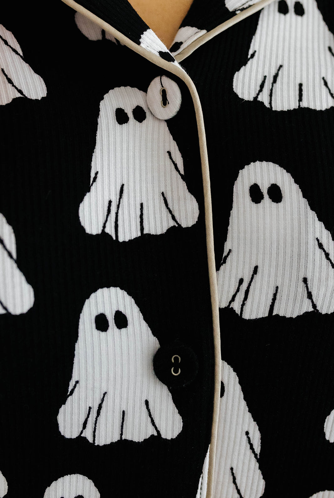 white ghost print on pajama top with beige lining