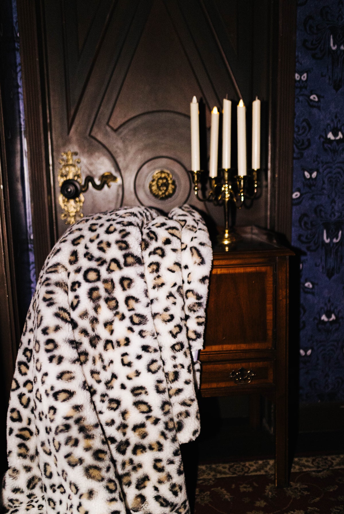 Leopard faux fur blanket draped over a chair