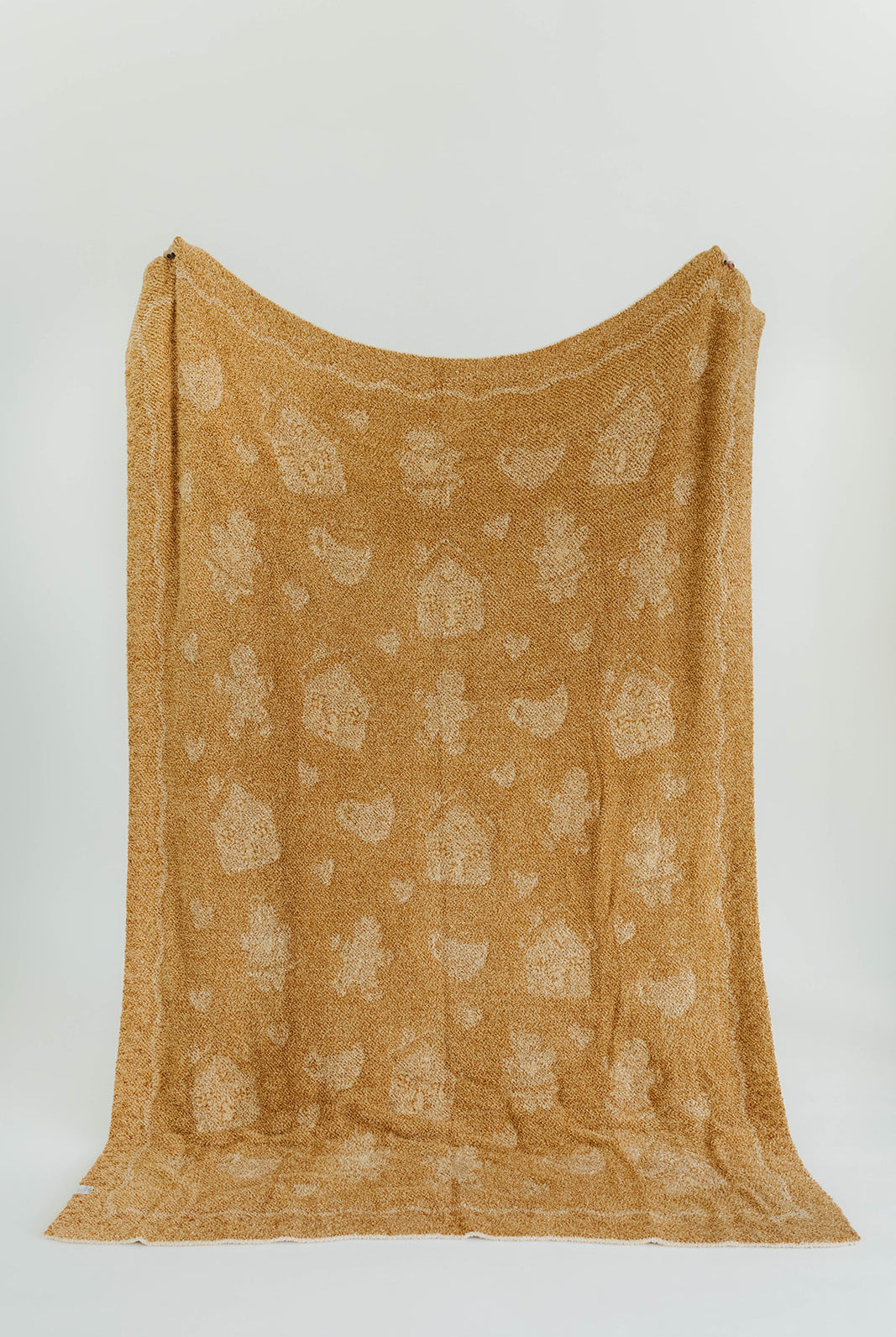 Brown textured fabric with a subtle pattern on a white background