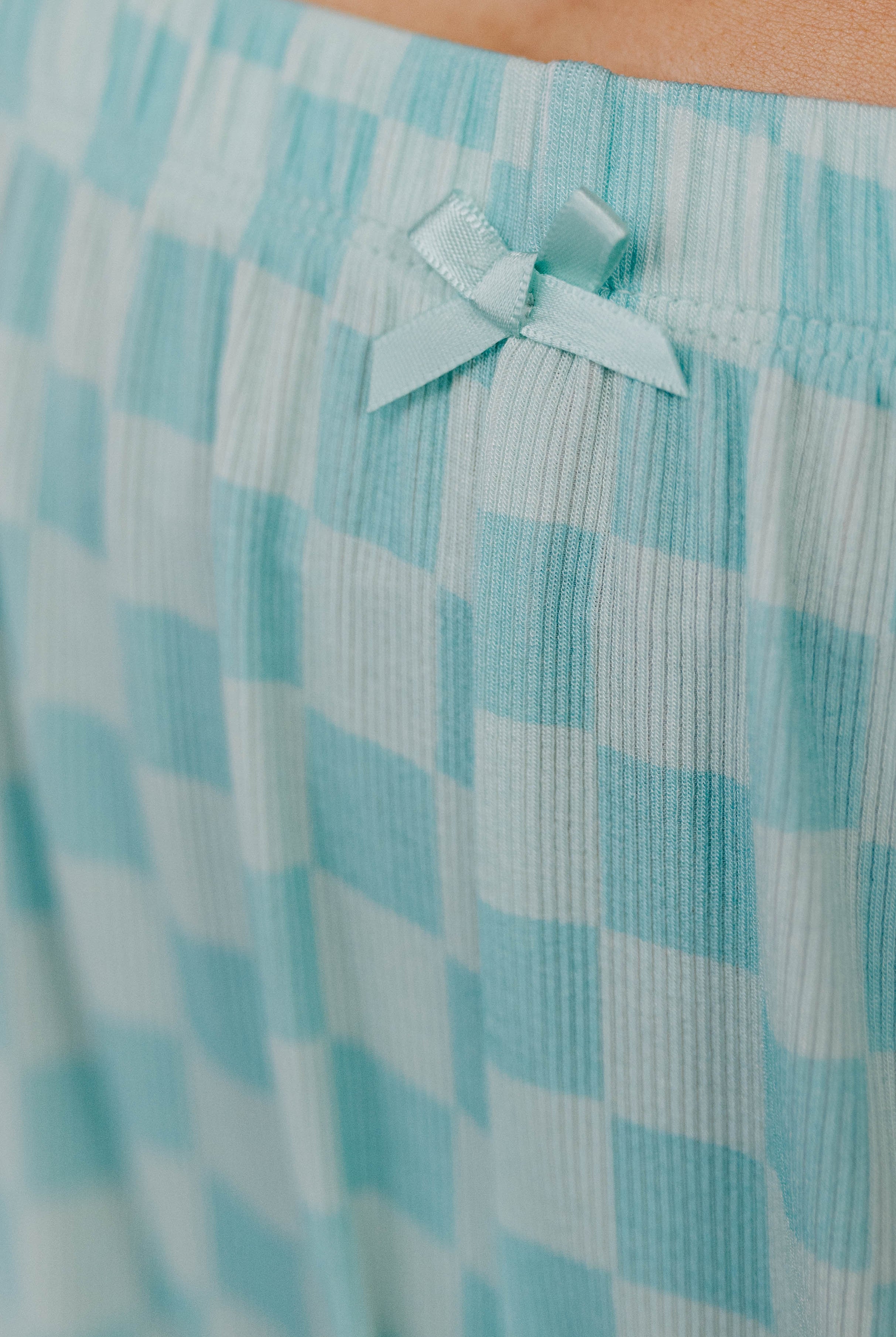 Close-up of a light blue bow detail