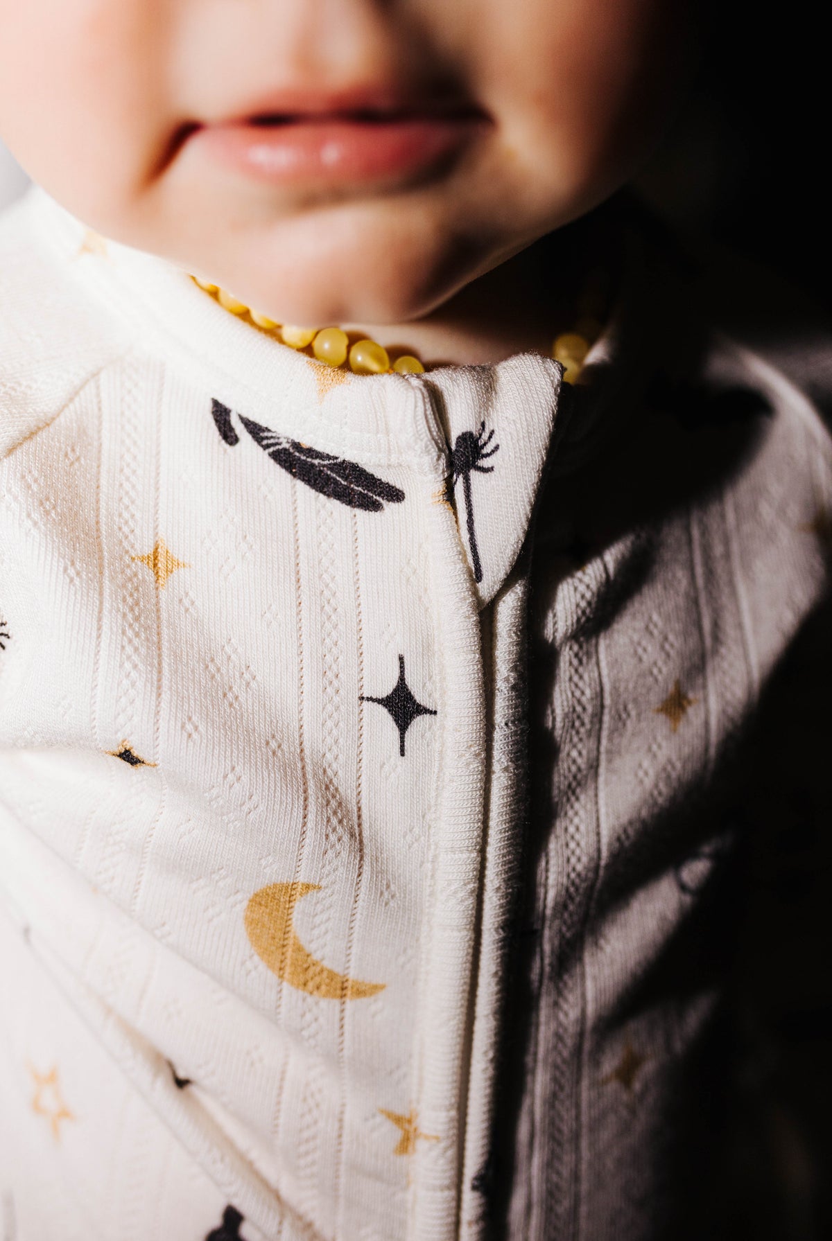 Close view of the zipper on Halloween Icon Print baby pajamas