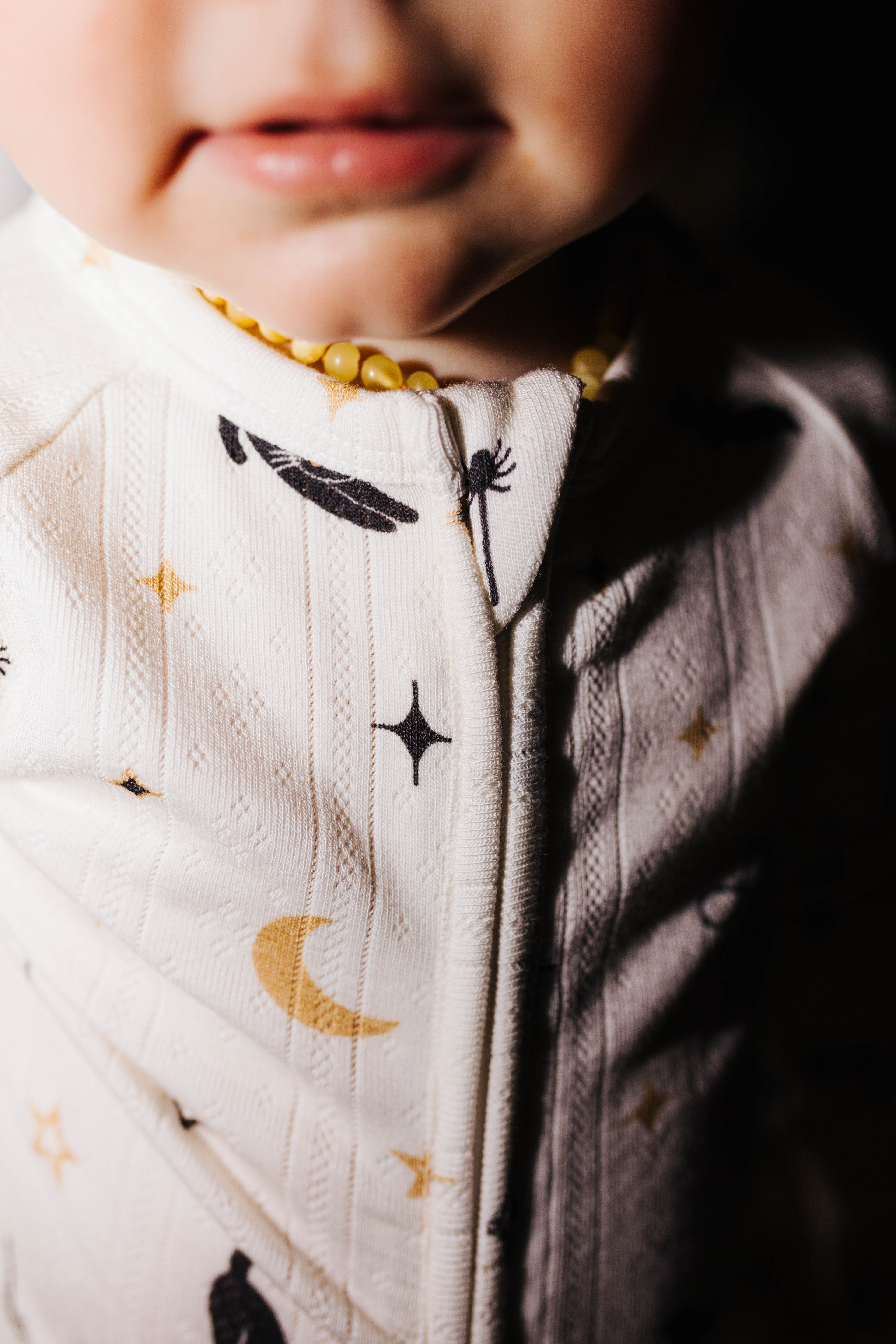 Close view of the zipper on Halloween Icon Print baby pajamas