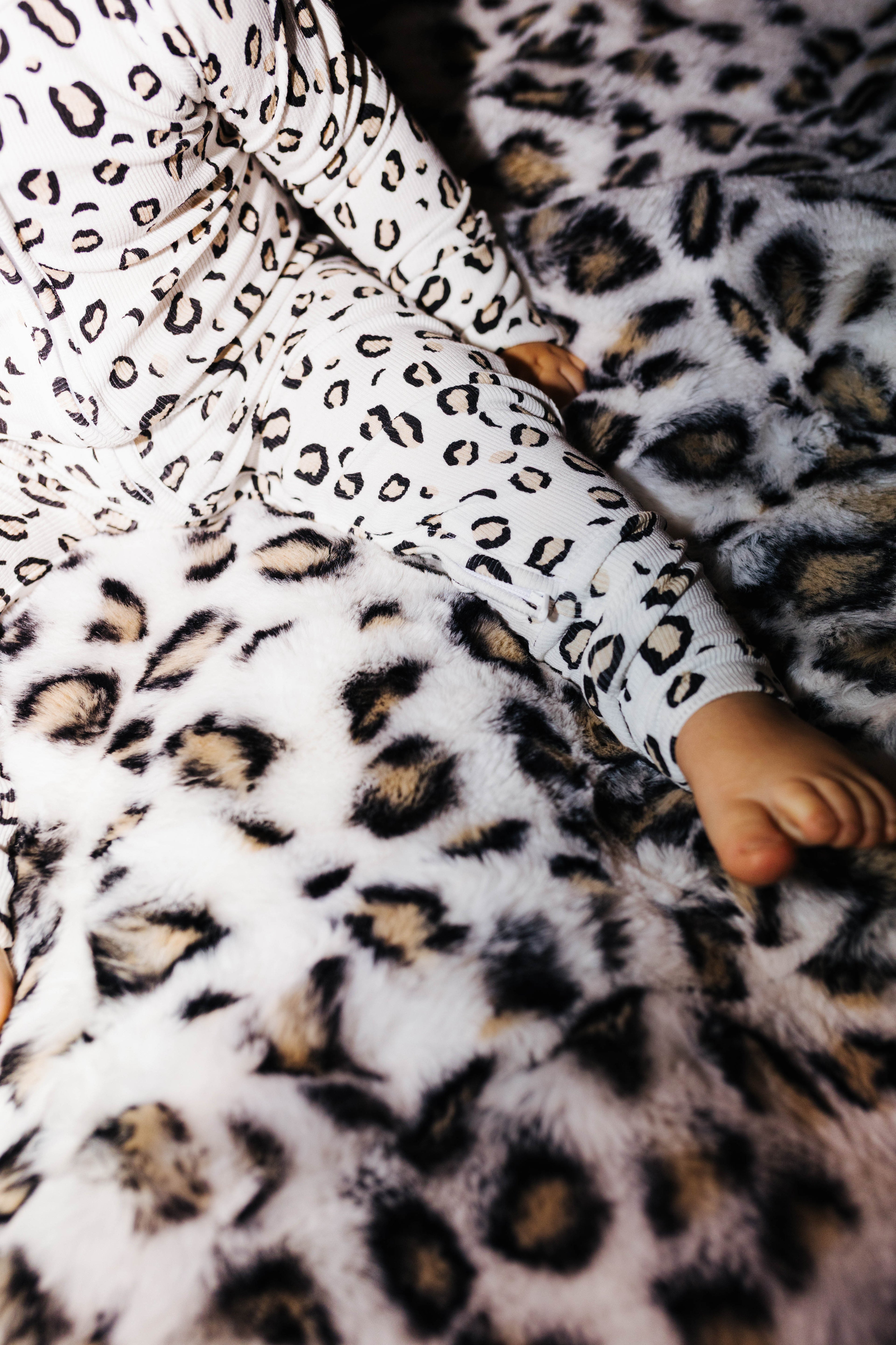 Close view of the zipper on baby leopard pajamas