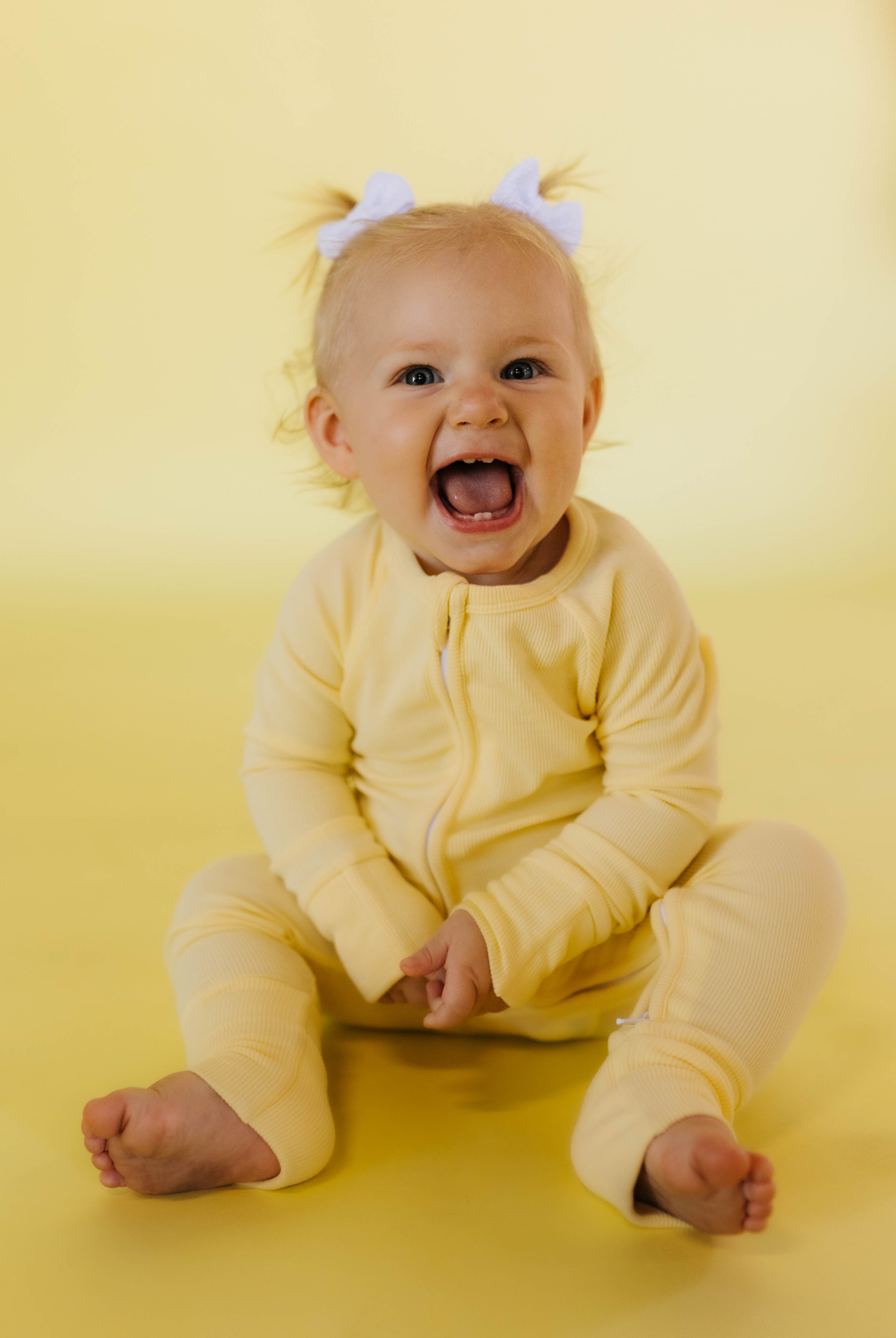 phoebe smiling big in the yellow pjs