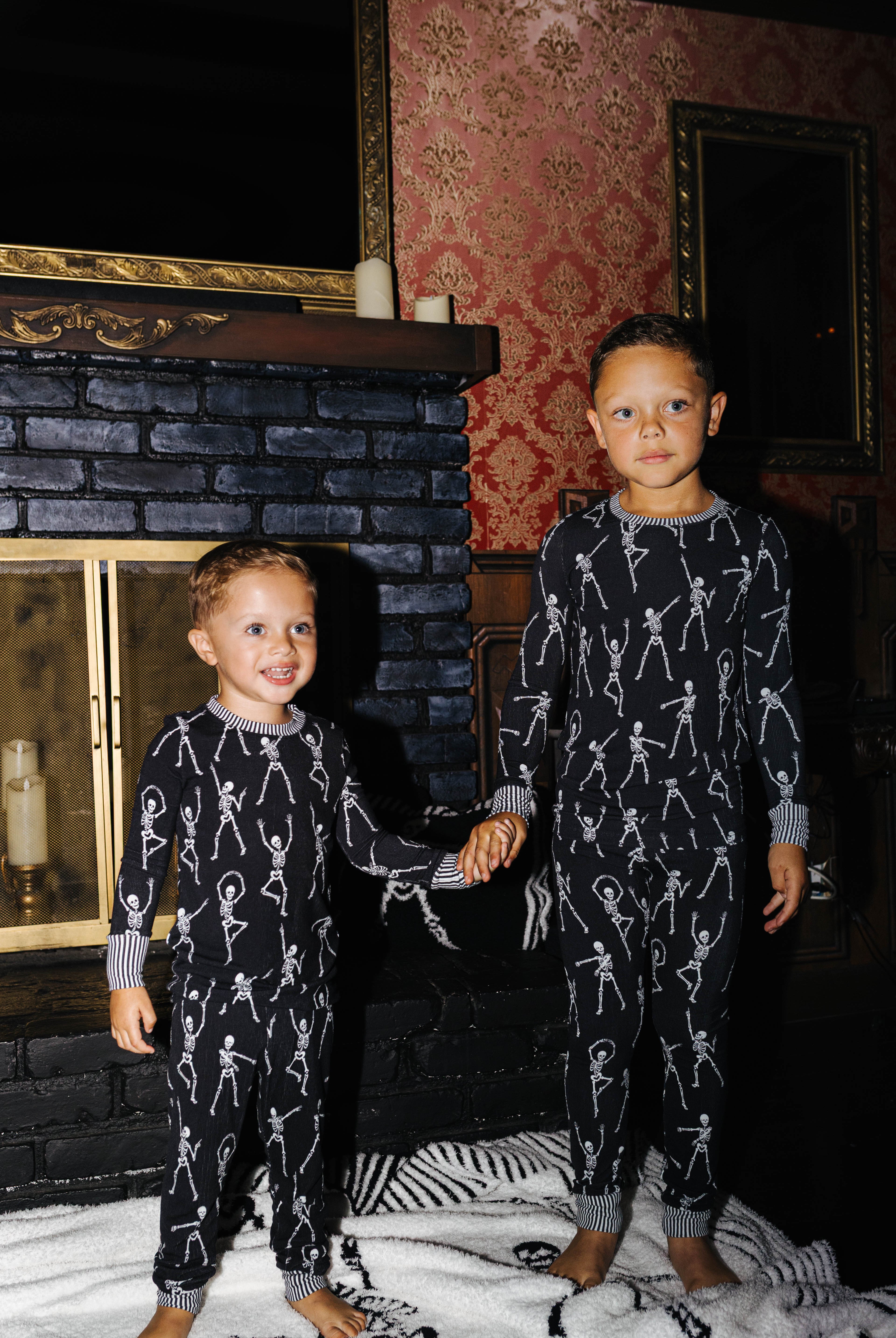 Two children in matching Skelly pajamas