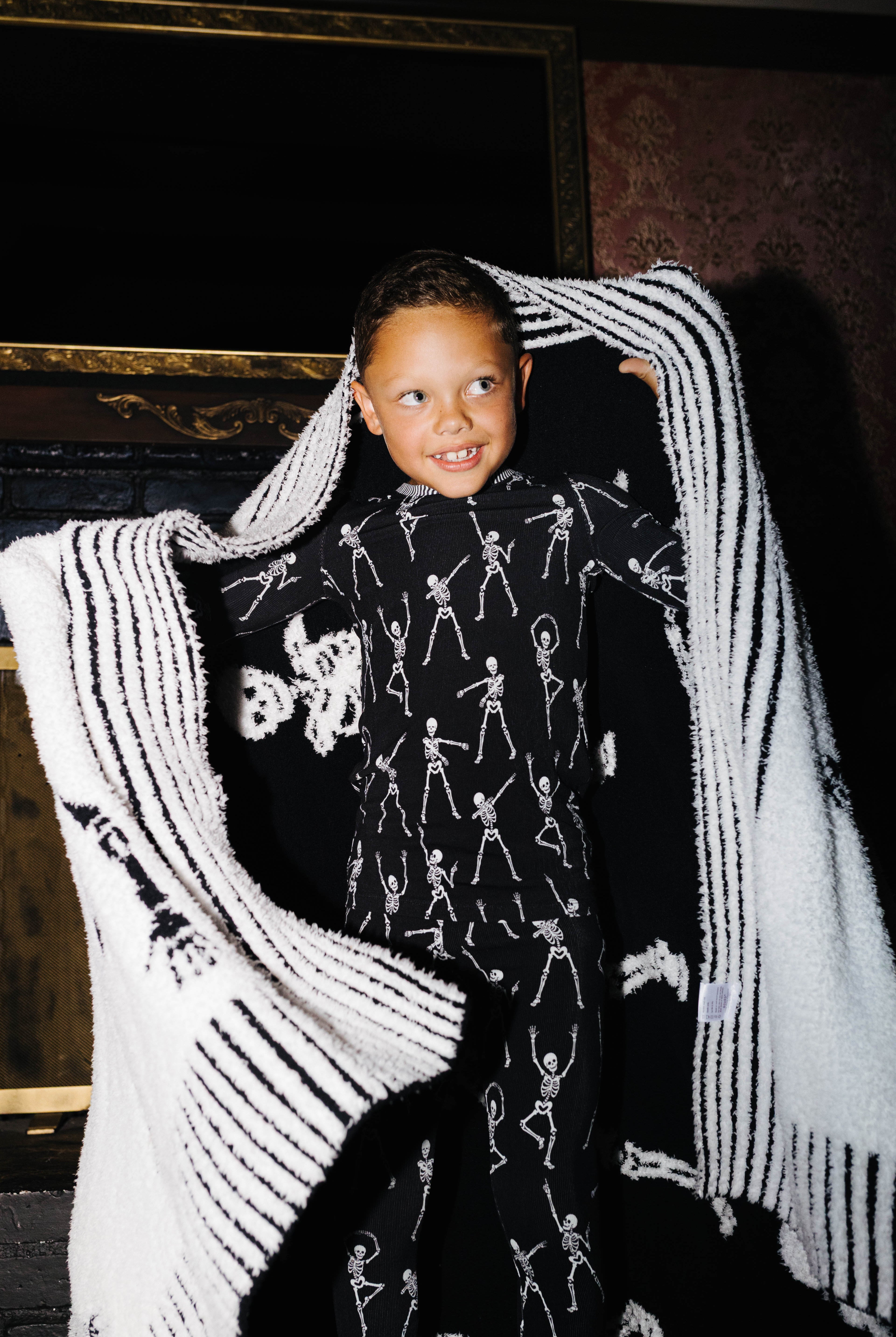 Skelly Blanket 60x80 shown in a full length lifestyle view