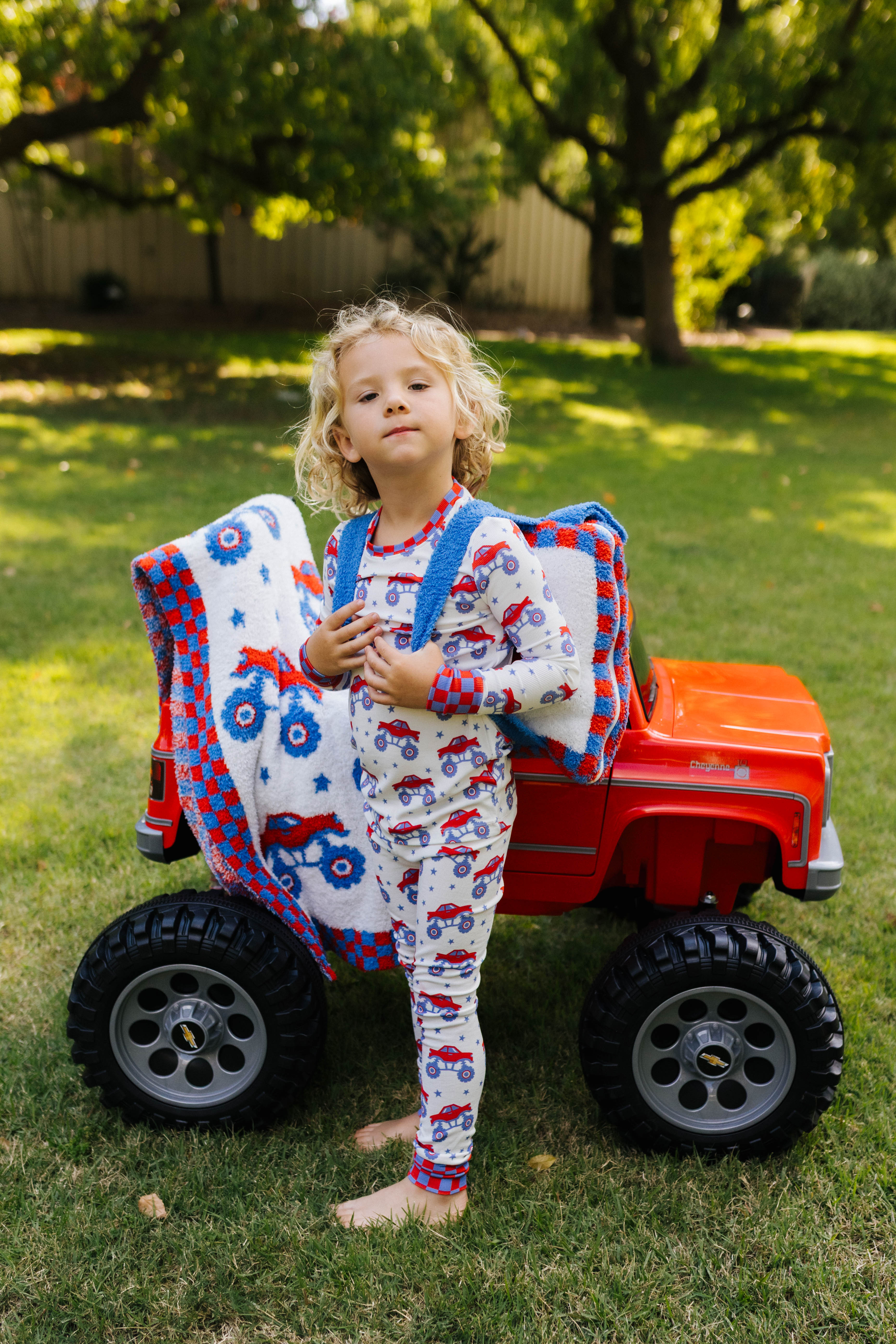 kamp posing with the quillow in front of the monster truck