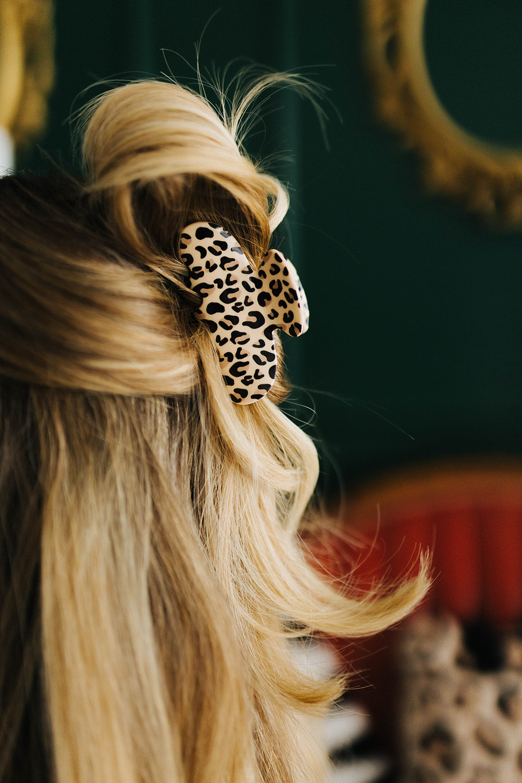 Leopard claw clip in woman's hair