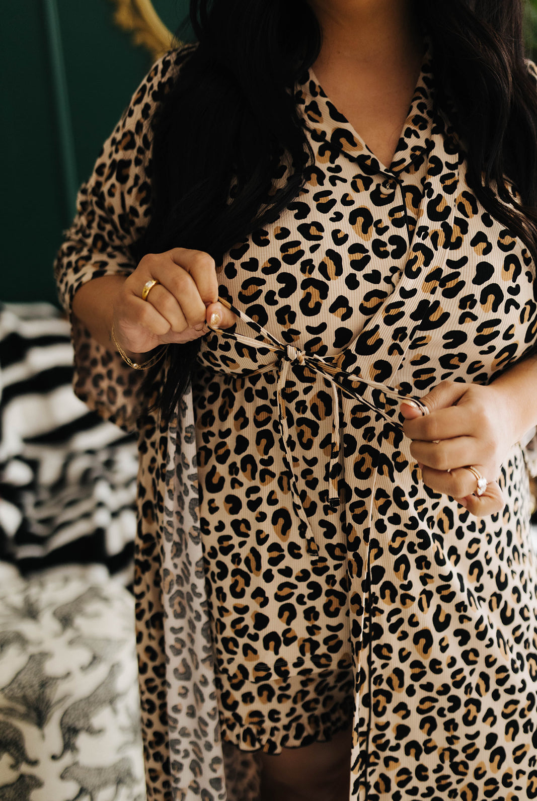 Person wearing a leopard print outfit with a blurred background