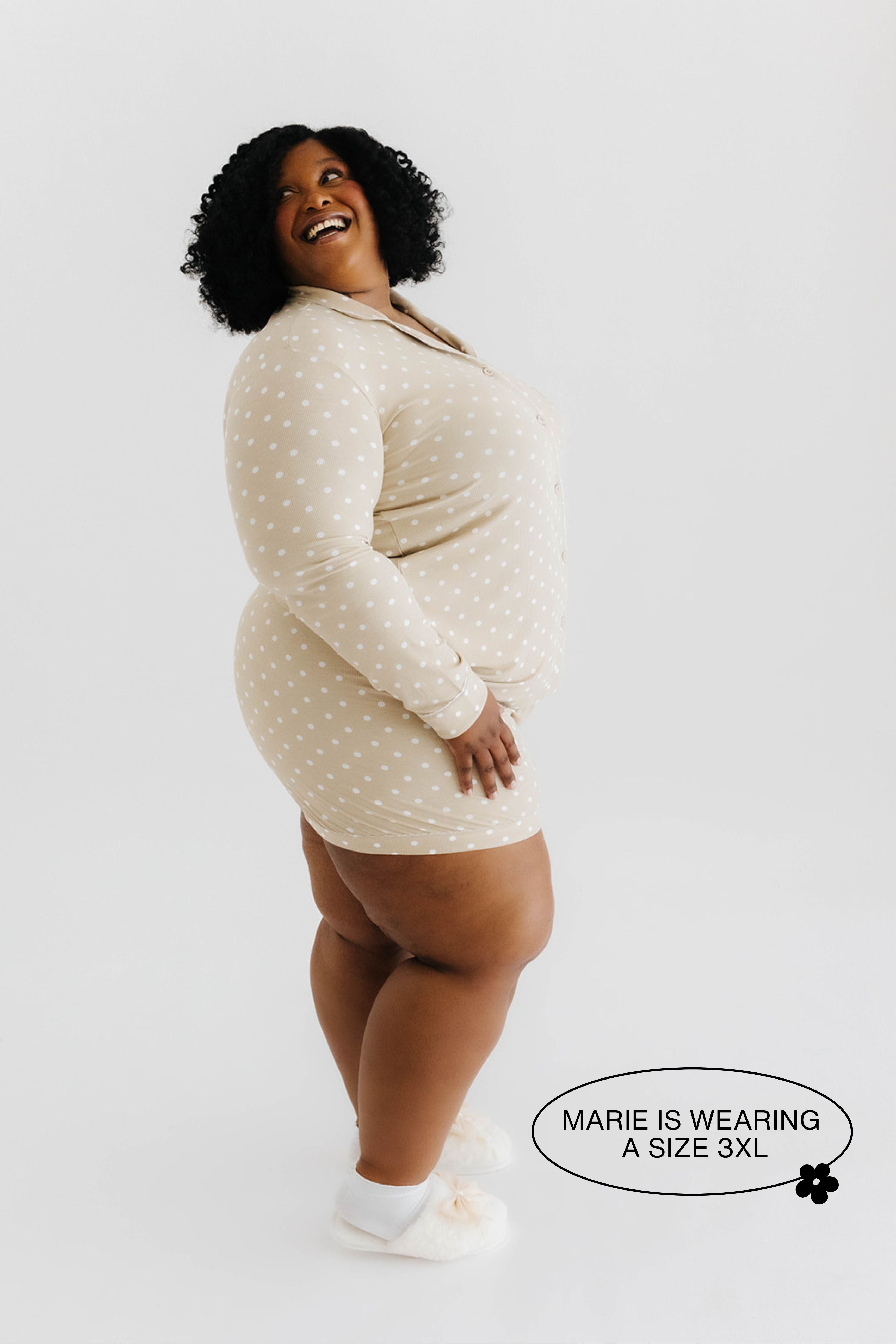 model smiling wearing 3x in polka dot pajamas