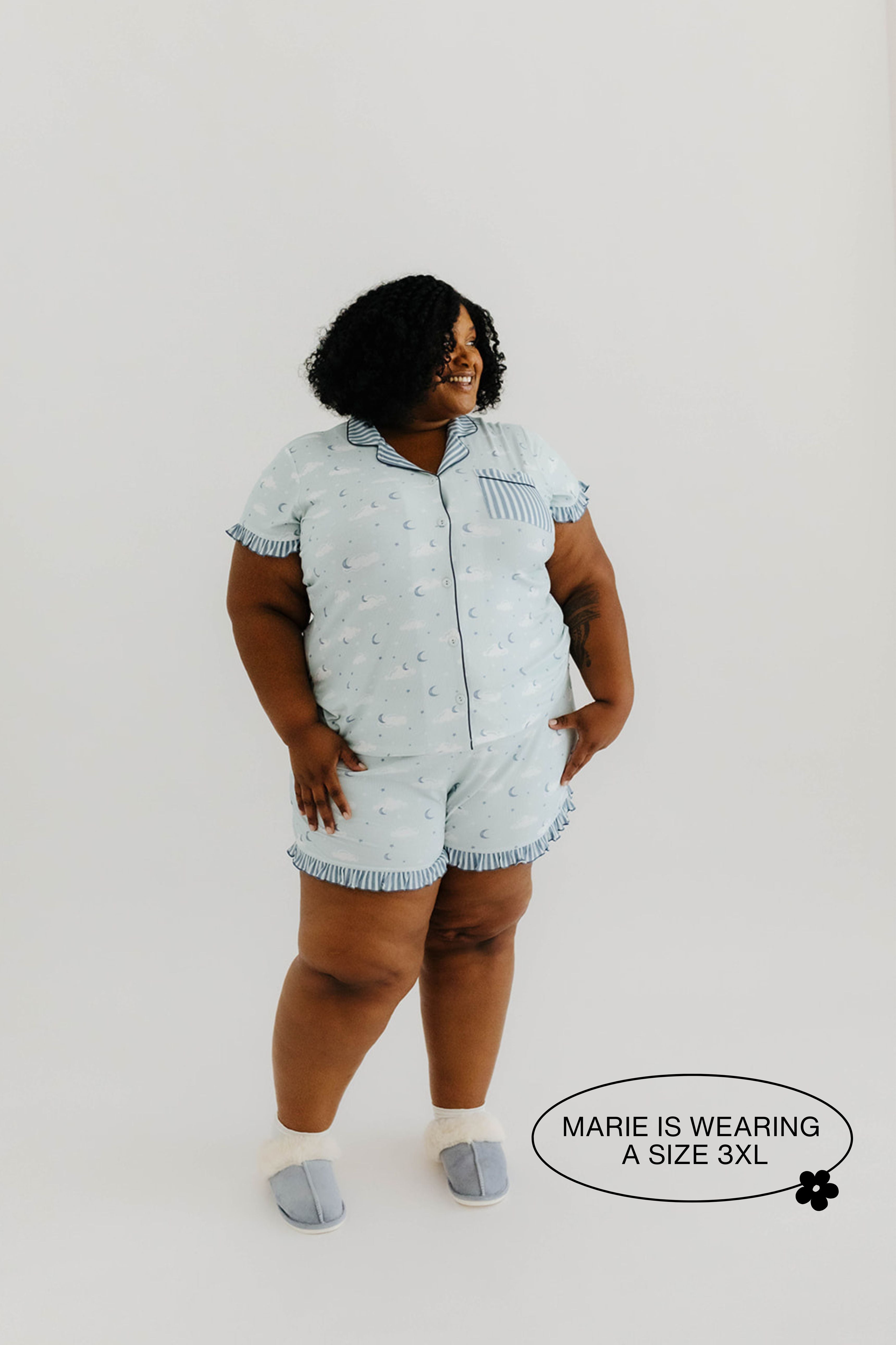 model mari is smiling looking away wearing a size 3x in the cloud ruffle pajamas