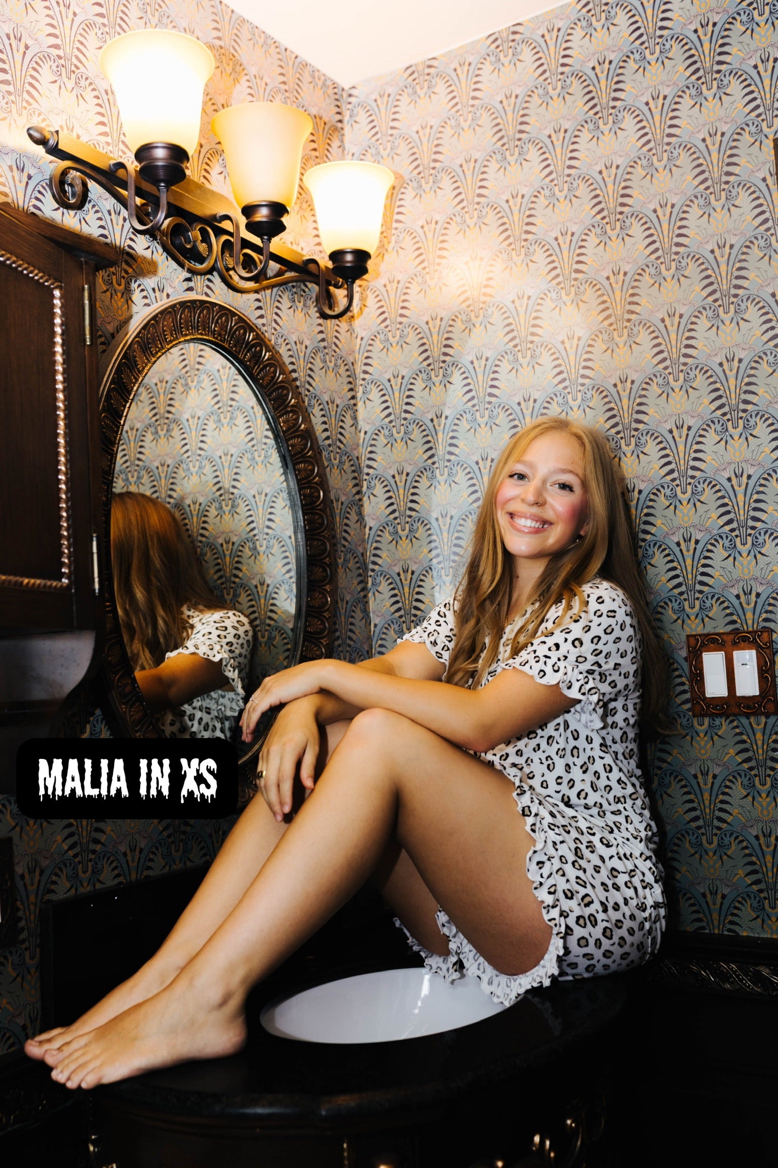 Malia wearing size XS in the Adult Leopard Ruffle Pajama Set